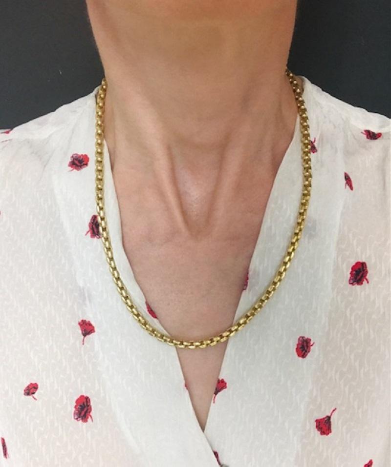 A nice and heavy (74.5 grams) box link chain by Tiffany & Co. made of 18k gold. Polished finish and rounded box links work together, creating amazingly smooth texture. This chain perfectly lays on a neck, and due its thickness looks fantastic being