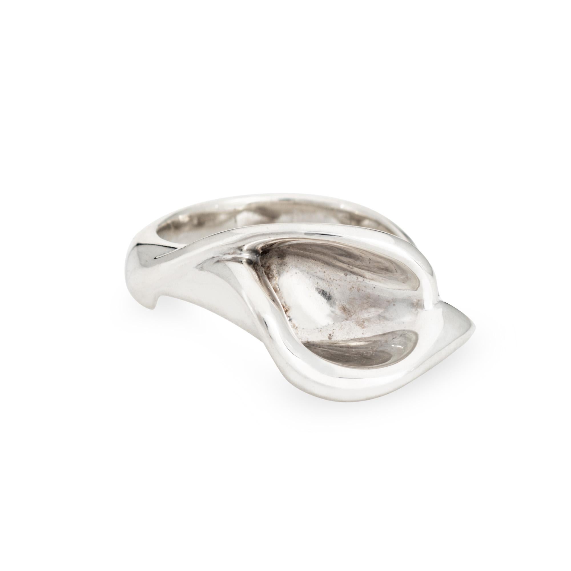 Vintage Tiffany & Co Calla Lily ring designed by Elsa Peretti, crafted in sterling silver.  

The sculpted design highlights a beautiful stylized Calla Lily. Designed by the famed Elsa Peretti, the ring is great worn alone as a statement piece or