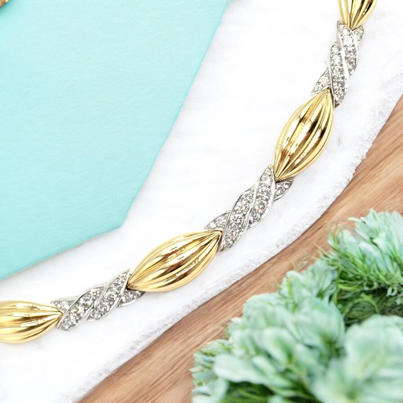 In a playful nod to the era’s vibrant fashion, this Tiffany & Co “Candy” necklace from the 1970s glistens with an impressive four carats of diamonds, meticulously set in 18k yellow and white gold. 
The luminous design features sculpted, candy-shaped