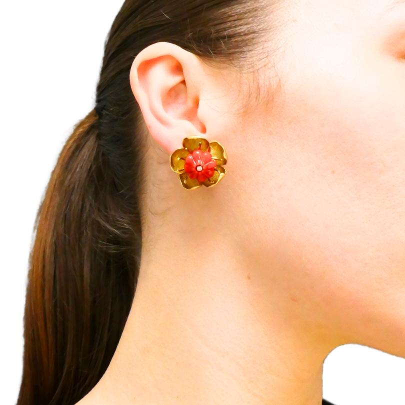 A pair of Tiffany & Co. coral floral earrings crafted of 18k gold.
Each earring showcases a beautiful flower, with petals crafted in gold featuring a textured finish. The gentle curves of the gold petals give the earrings a soft, lifelike