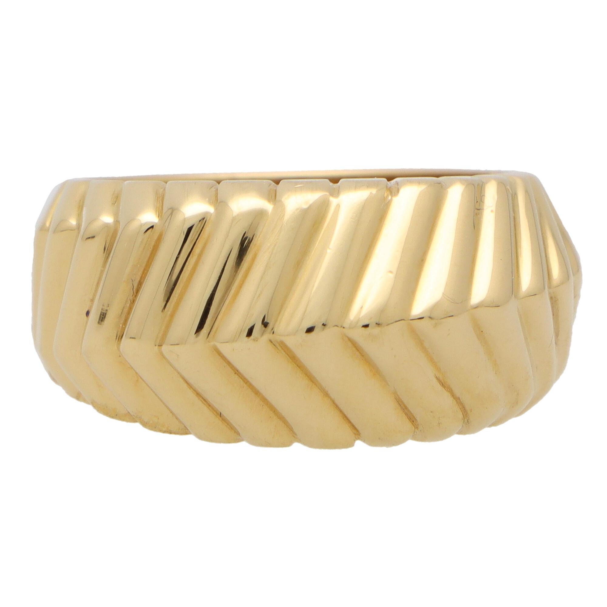 A beautiful vintage Tiffany & Co. 'Cordis' chevron bombe ring set in 18k yellow gold. 

From the now discontinued 'Cordis' collection, the piece is composed in a bombe style with a raised chevron design. The chevron design travels across the band