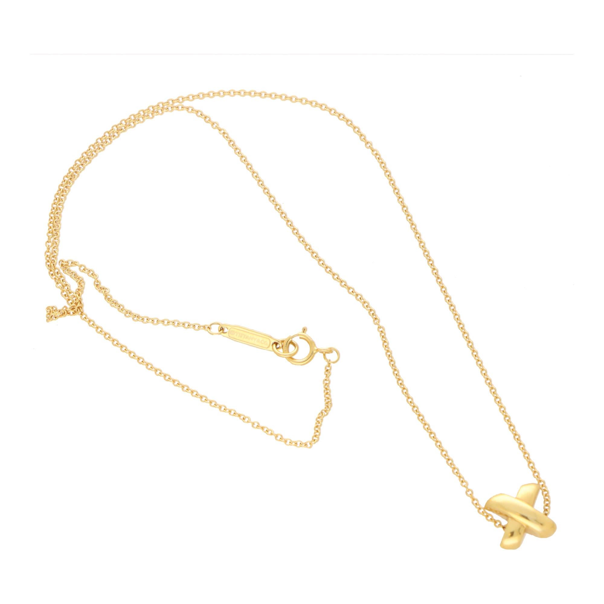 A beautiful vintage Tiffany & Co. ‘Cross Stitch’ pendant necklace set in 18k yellow gold.

The necklace is solely set with a cross stitch motif which hangs freely from a 16-inch Tiffany gold chain. The chain is secured with a clasp fitting.

Due to