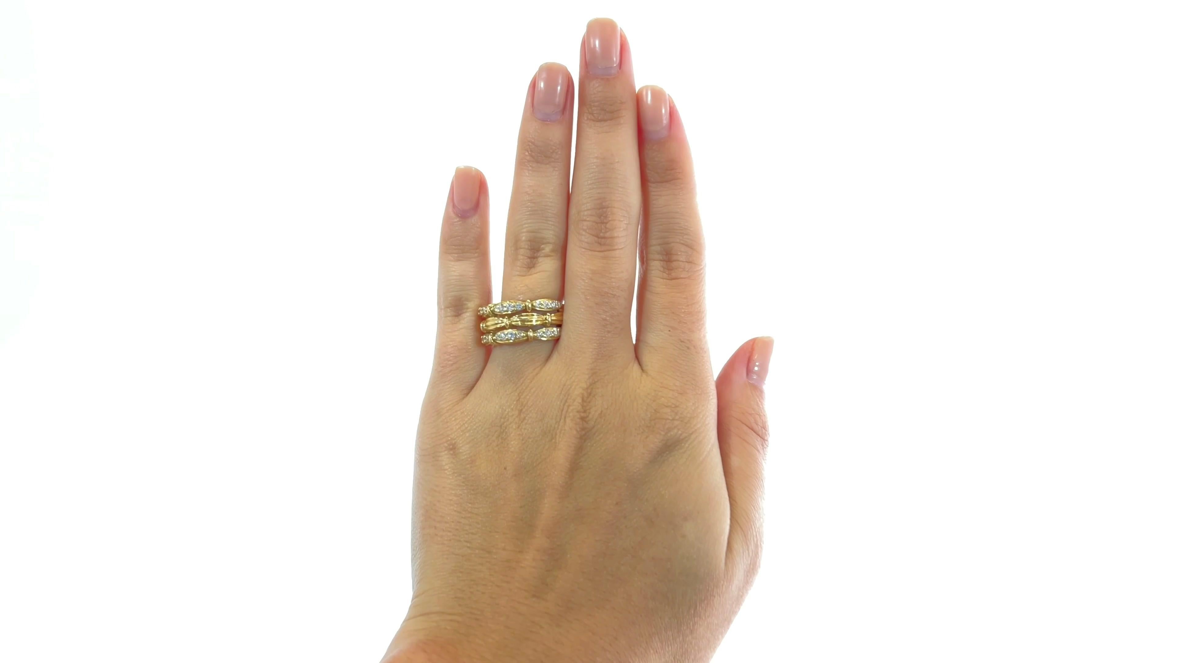 Vintage Tiffany & Co. Diamond 18 Karat Gold Ring. Featuring 24 Round Brilliant Cut diamonds approximately 0.72 carat total, D-E color, VVS clarity. Signed Tiffany & Co. 1992 with purity mark. Circa 1990s. Size 7 1/2 and may be resized.

About The