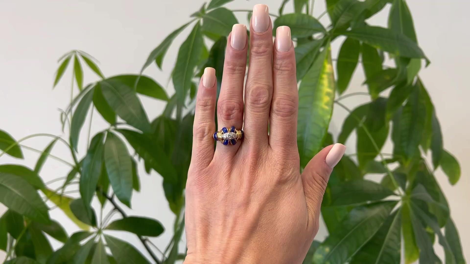 One Vintage Tiffany & Co. Diamond and Lapis 18K Yellow Gold Platinum Ring. Featuring three round brilliant cut diamonds with a total weight of approximately 0.20 carat, graded F color, VS1 clarity. Accented by six polished pieces of lapis lazuli.