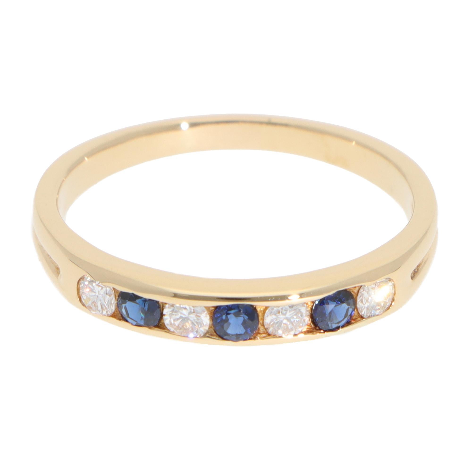 A beautiful vintage Tiffany & Co. diamond and sapphire half-eternity channel ring set in 18k yellow gold.

The ring is composed of 4 round brilliant-cut diamonds and 3 round blue sapphires. The sapphires are perfectly matched in colour and vibrancy.