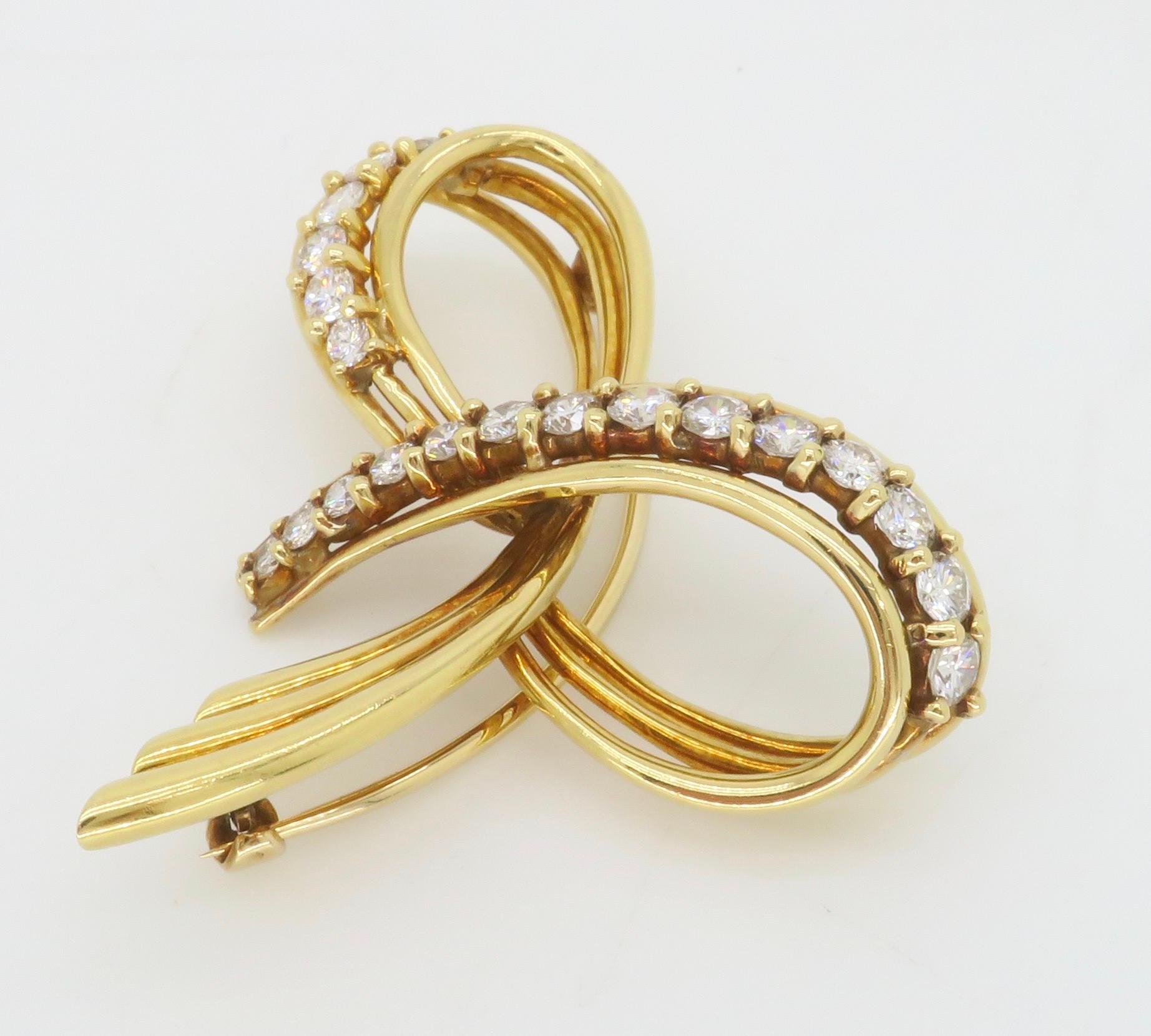 Vintage Tiffany & Co. Diamond brooch made in 18k yellow gold. 

Diamond Carat Weight: Approximately 1.80CTW
Diamond Cut: Round Brilliant Cut Diamonds 
Color: Average E-F
Clarity: Average VS
Metal: 18k Yellow Gold 
Stamped: 