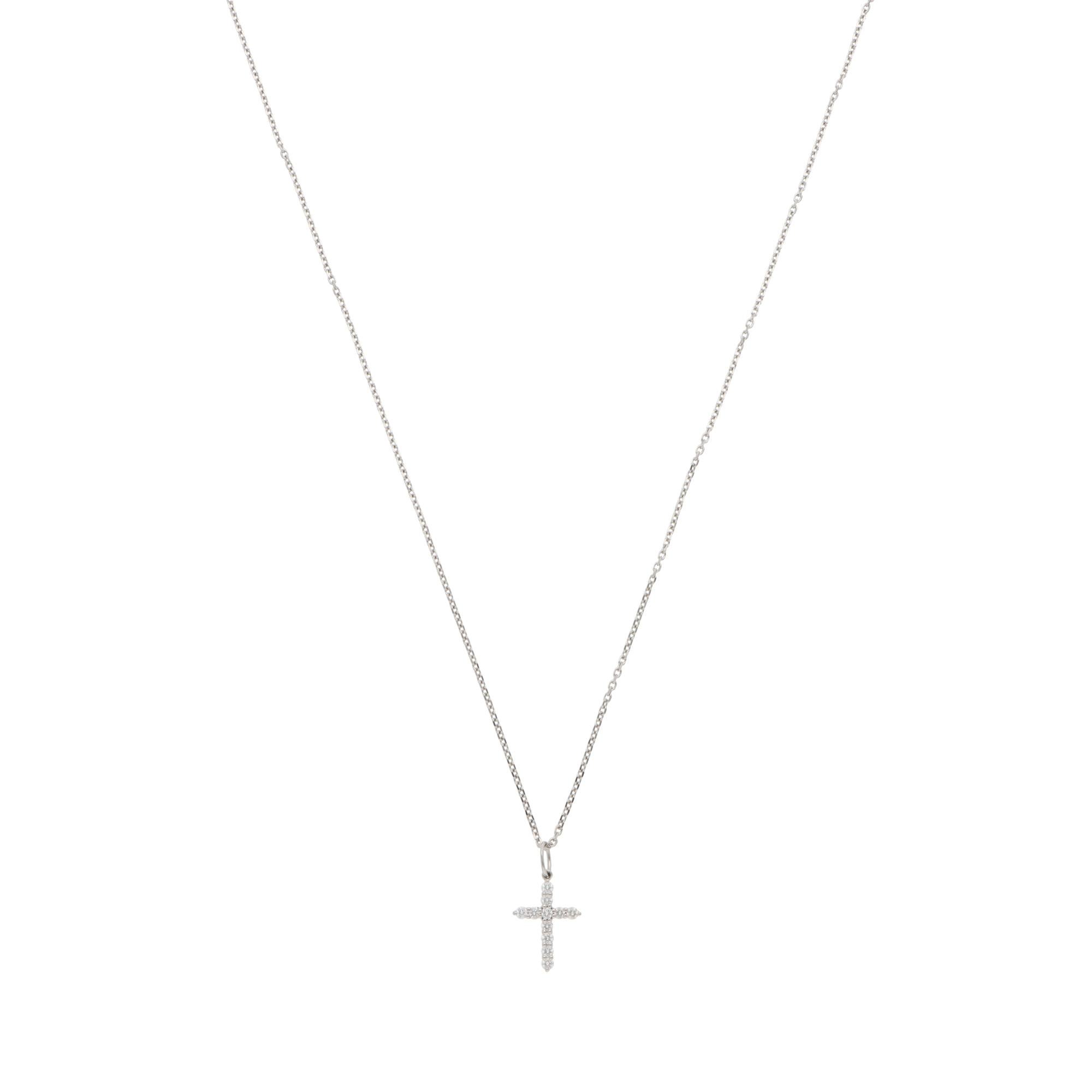 A beautiful vintage Tiffany & Co. diamond cross pendant necklace set in platinum.

From the current Tiffany & Co. collection, the pendant depicts a cross motif and is set with 11 round brilliant-cut diamonds. The diamonds are secured in claw