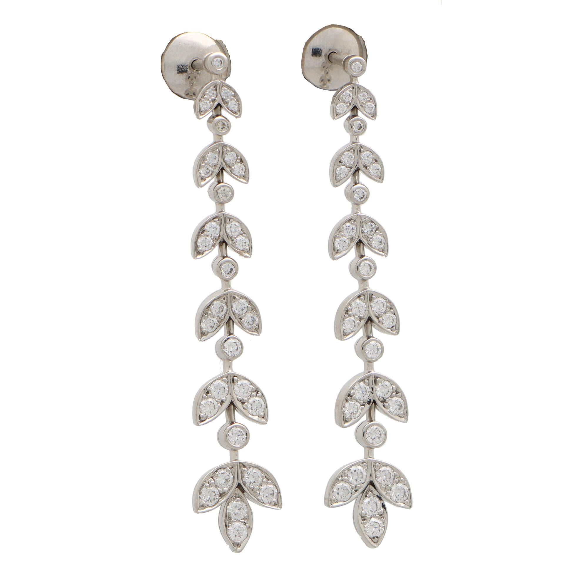 A beautiful pair of vintage Tiffany & Co. ‘Wisteria’ earrings set in platinum.

From the now discontinued ‘Wisteria’ collection, each earring depicts an elegant graduating wisteria branch. Each branch is intricately set with round brilliant cut