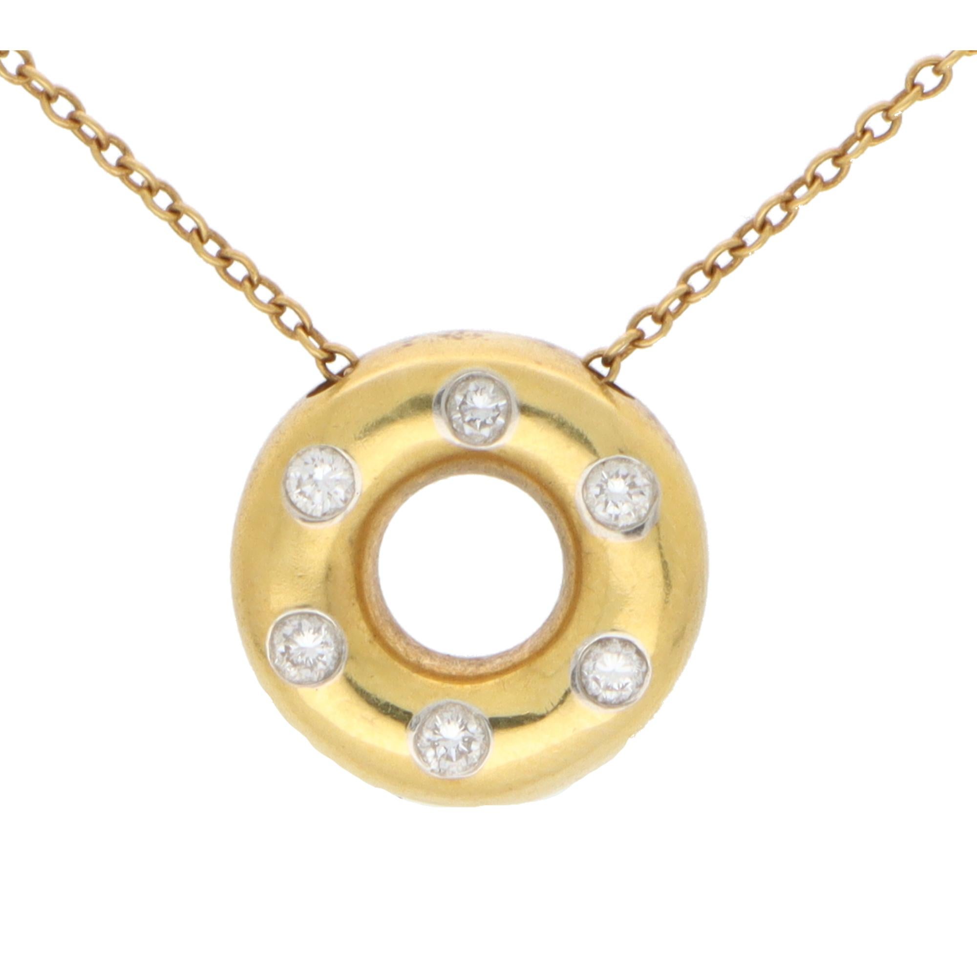  A beautiful vintage Tiffany & Co. ‘Etoile’ diamond pendant set in platinum and 18k yellow gold.

From the now discontinued ‘Etoile’ collection, the pendant depicts a solid yellow gold doughnut rubover set with six round brilliant cut diamonds. Each