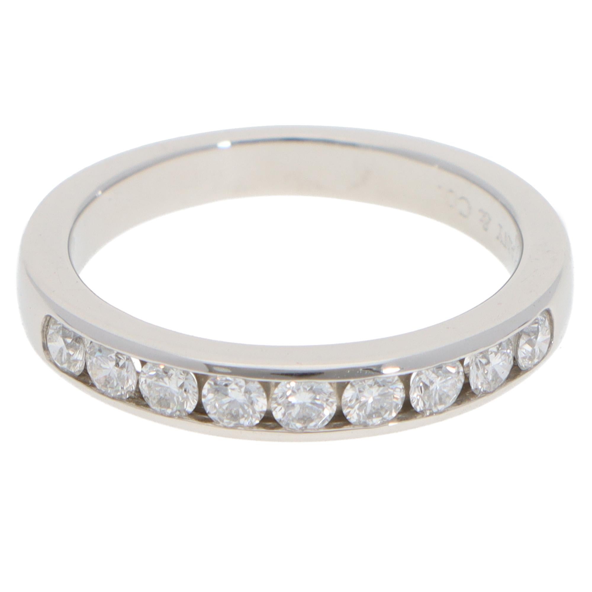 A beautiful vintage Tiffany & Co. diamond half-eternity ring set in platinum.

The ring is composed of 9 round brilliant cut diamonds, channel set securely within a 3-millimetre platinum band. This half-eternity ring is perfect for everyday wear. It