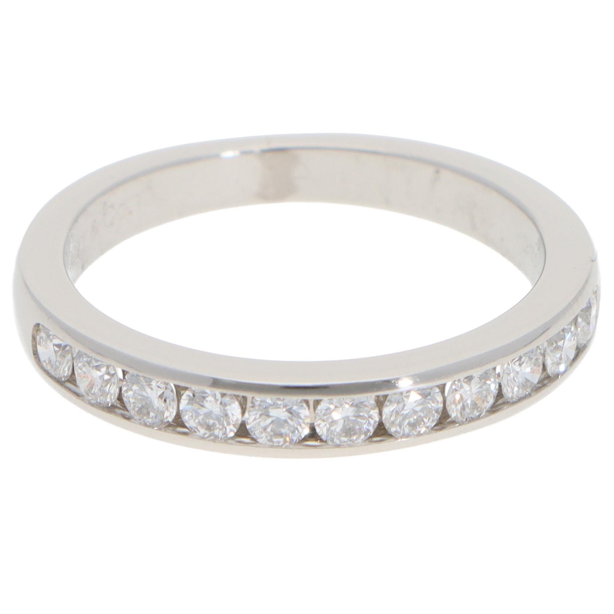 A beautiful vintage Tiffany & Co. diamond half-eternity ring set in platinum.

The ring is composed of 11 round brilliant cut diamonds, channel set securely within a 3-millimetre platinum band. This half-eternity ring is perfect for everyday wear.
