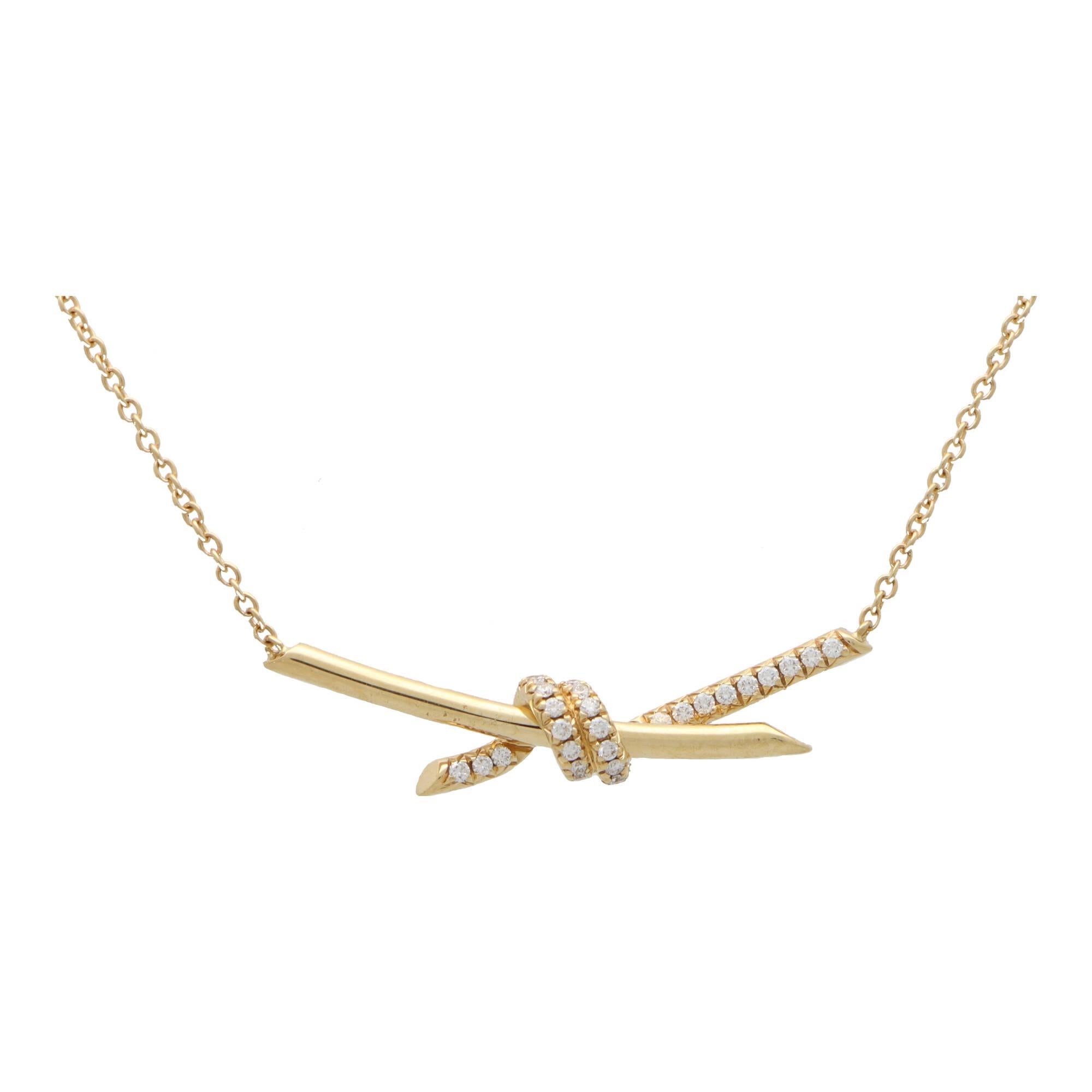 A beautiful vintage Tiffany & Co. knot pendant necklace set in 18k yellow gold.

From the current ‘Tiffany Knots’ collection, the pendant depicts an elegant knot motif; pave set with 31 round brilliant cut diamonds. The knot hangs from a 15-17 inch