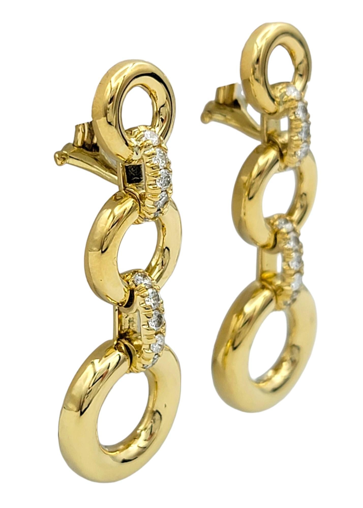 Sophisticated in design and iconic in craftsmanship, these Tiffany & Co. linear circle drop earrings bring timeless elegance to any ensemble. Crafted in glowing 18 karat yellow gold, the design features three open circles linked in a graceful