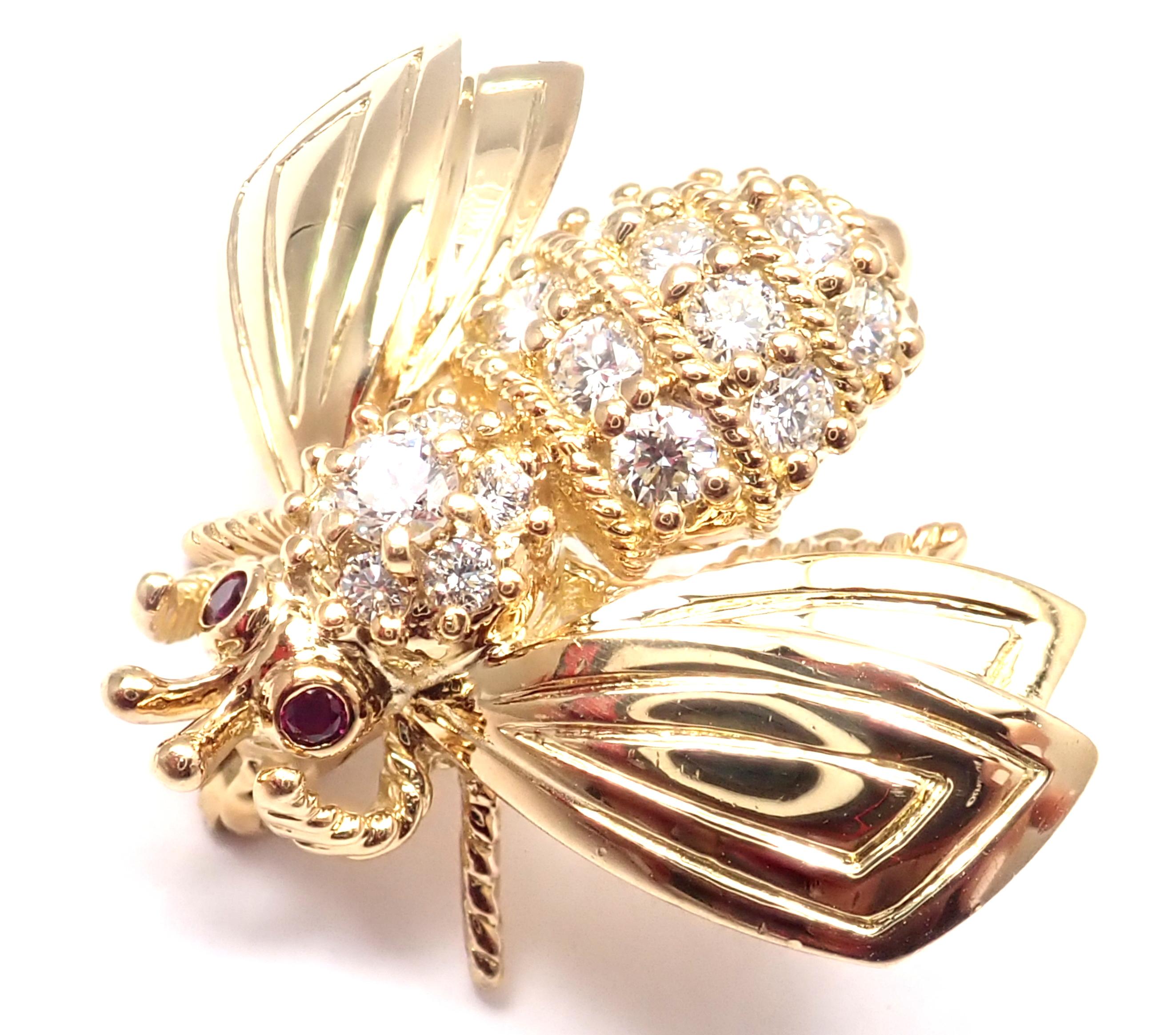 18k Yellow Gold Diamond Ruby Bee Brooch Pins by Tiffany & Co. 
With 17 Diamonds Total weight approx. .65ct VS1-VS2 clarity, G color
2 small round rubies in the eyes
Details: 
Measurements: 22mm x 26mm
Weight: 6.9 grams
Stamped Hallmarks: Tiffany &