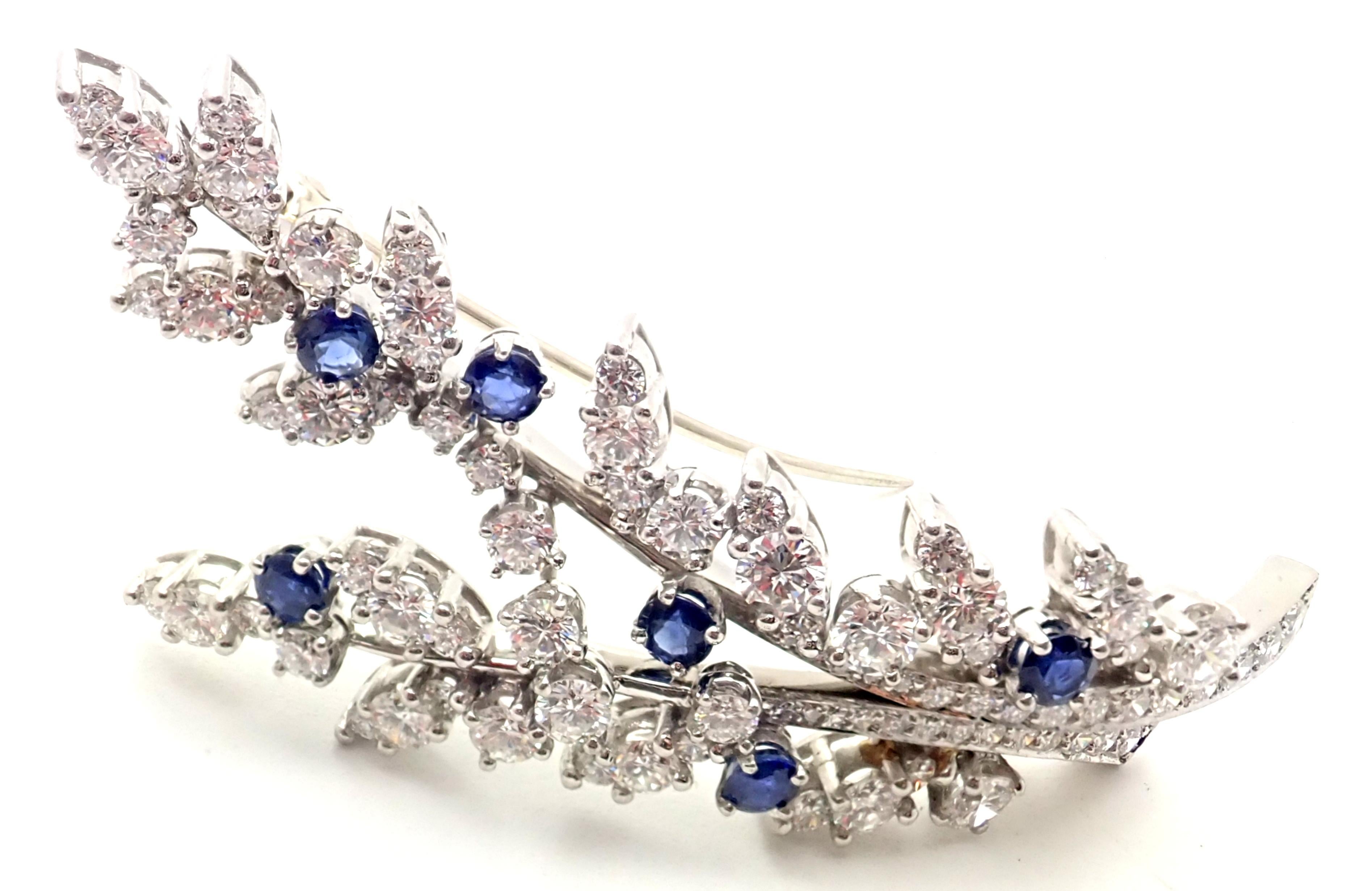 Vintage Platinum Diamond Sapphire Flower Pin Brooch by Tiffany & Co.
With 85 Round brilliant cut diamonds VS1 clarity, G color total weight approx. 3.5ct
6 Round sapphires total weight approx. 1.25ct
Details:
Measurements: 2 1/4