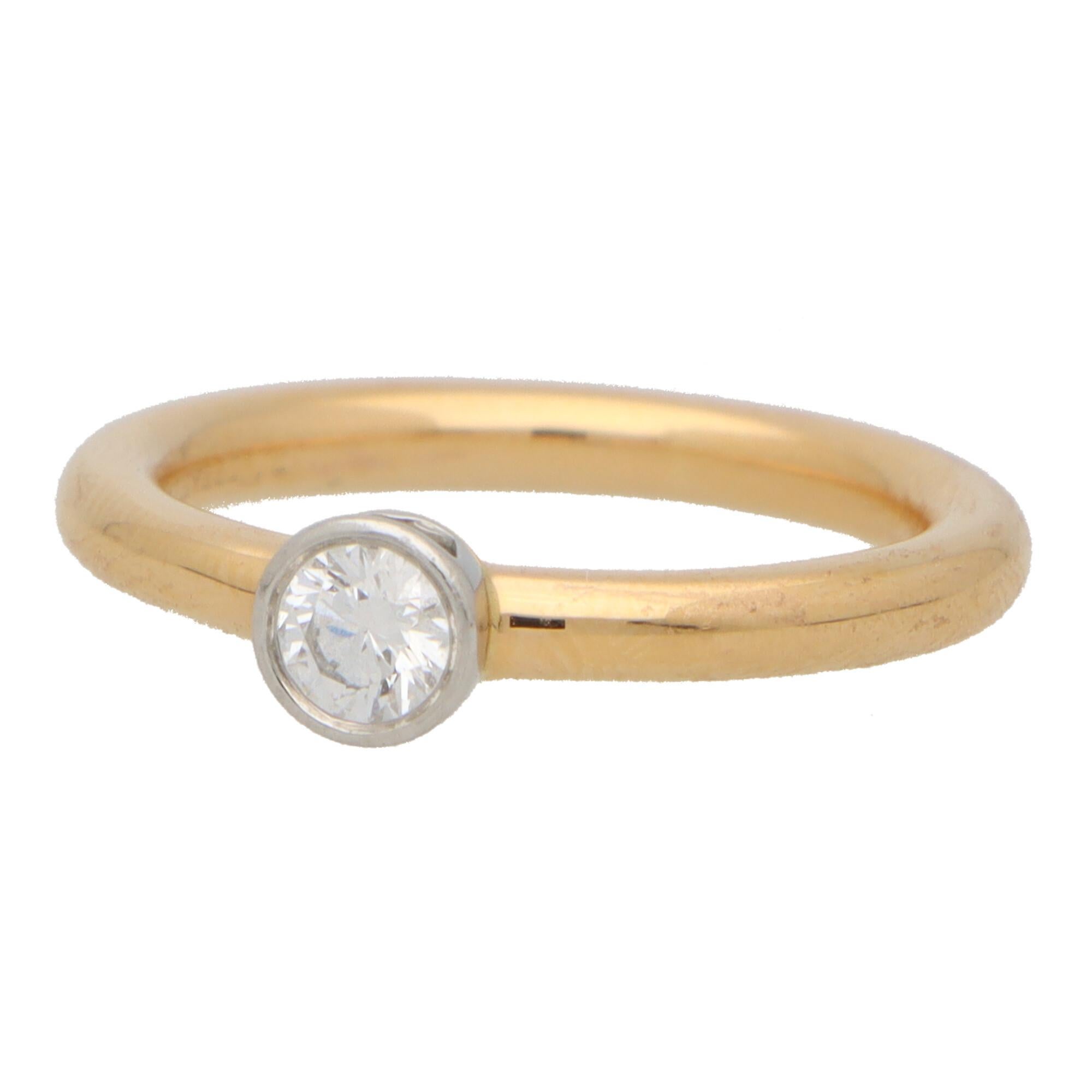 A beautiful vintage Tiffany & Co. single solitaire ring set in 18k rose gold and platinum.

The piece solely features a beautiful 0.20 carat round brilliant diamond. The diamond is bezel set to centre which flows round nicely to a 2.5-millimetre