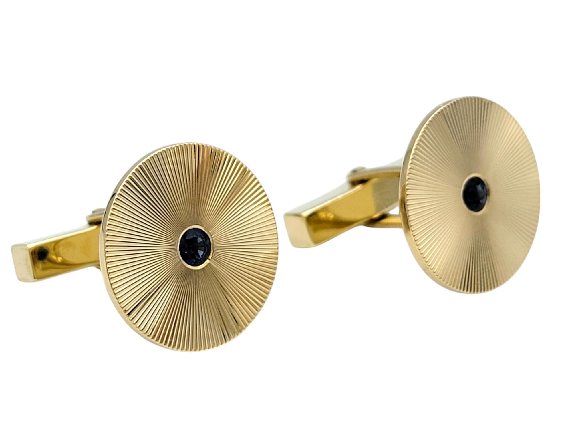 Add a refined touch to your formal attire with this exquisite pair of vintage Tiffany & Co. cufflinks, crafted in timeless 14 karat yellow gold. The disc-shaped design features a captivating texture, drawing attention to the elegant simplicity and
