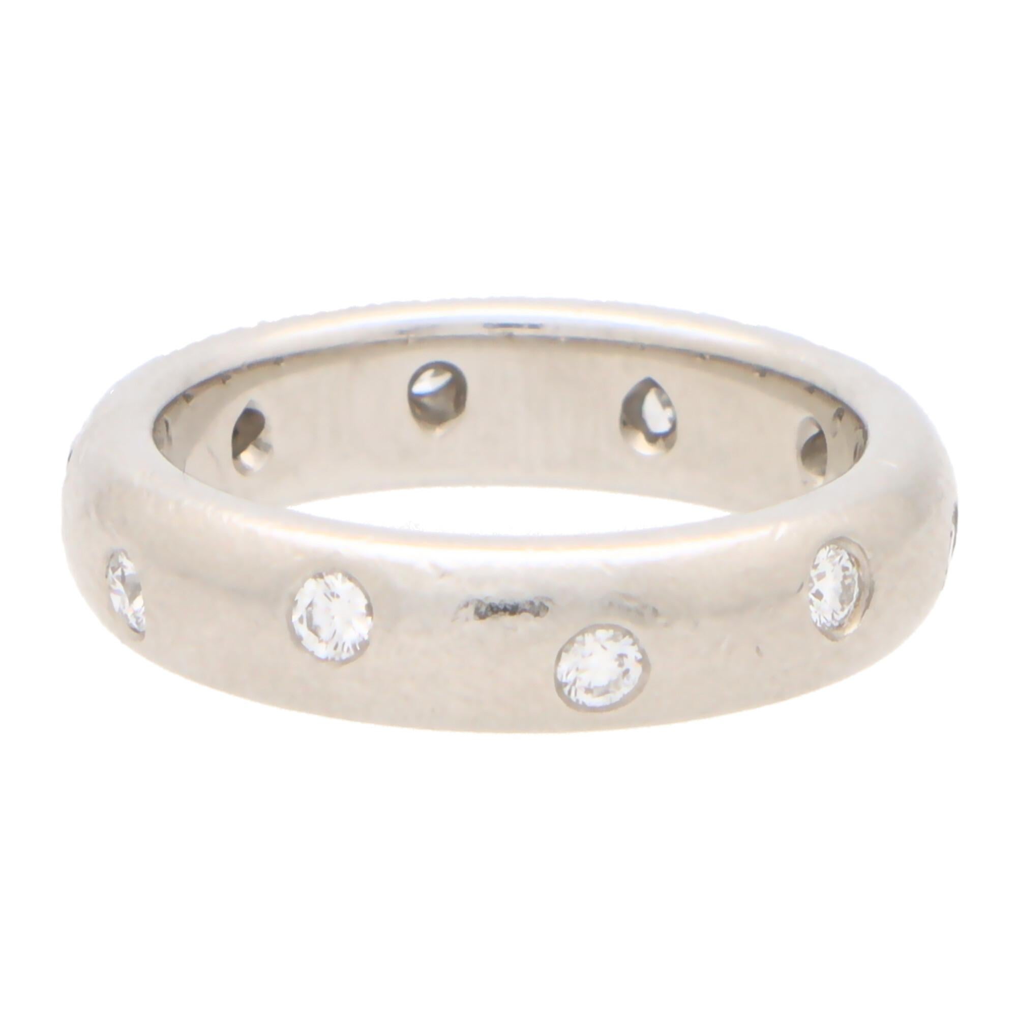 A lovely vintage Tiffany & Co. round brilliant cut diamond scattered full diamond eternity band ring set in platinum.

The full eternity ring is set with exactly 10 round brilliant cut diamonds; all of which are rub over set within a 4-millimetre
