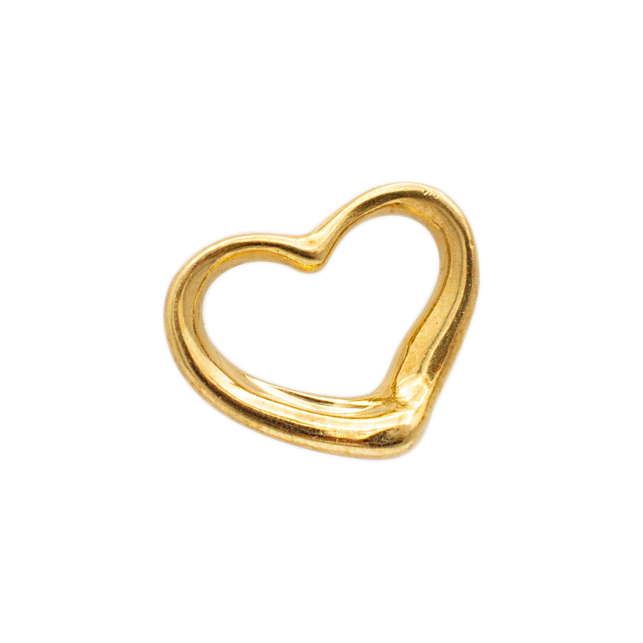 Gender: Ladies

Metal Type: 18K Yellow Gold

Length: 0.50 Inches

Width: 14.70 mm

Weight: 1.56 grams

Ladies 18K yellow gold symbol vintage heart-shaped pendant. Engraved with 