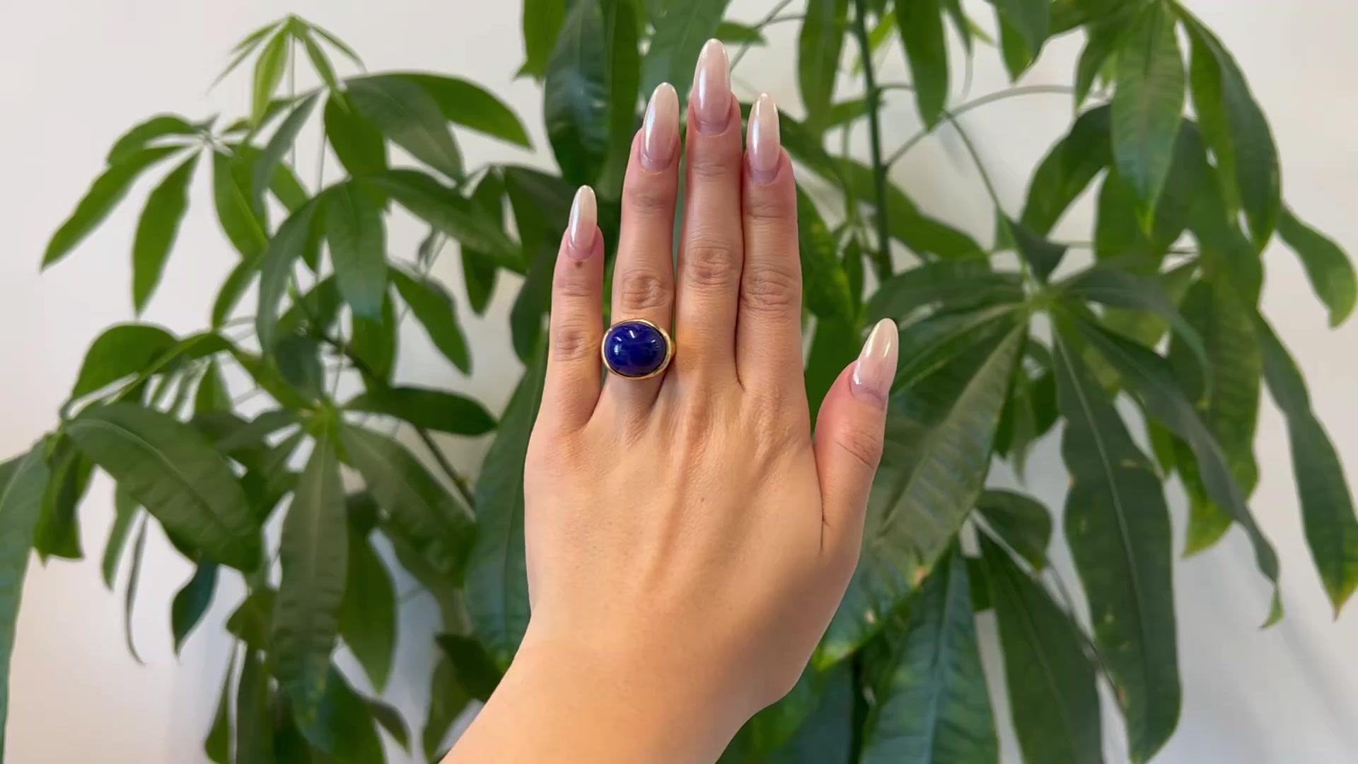 One Vintage Tiffany & Co. Elsa Peretti Lapis Lazuli Cabochon Cut 18K Yellow Gold Ring. Featuring one cabochon cut lapis lazuli weighing approximately 14.00 carats. Crafted in 18 karat yellow gold, signed Tiffany & Co. and Elsa Peretti, with purity