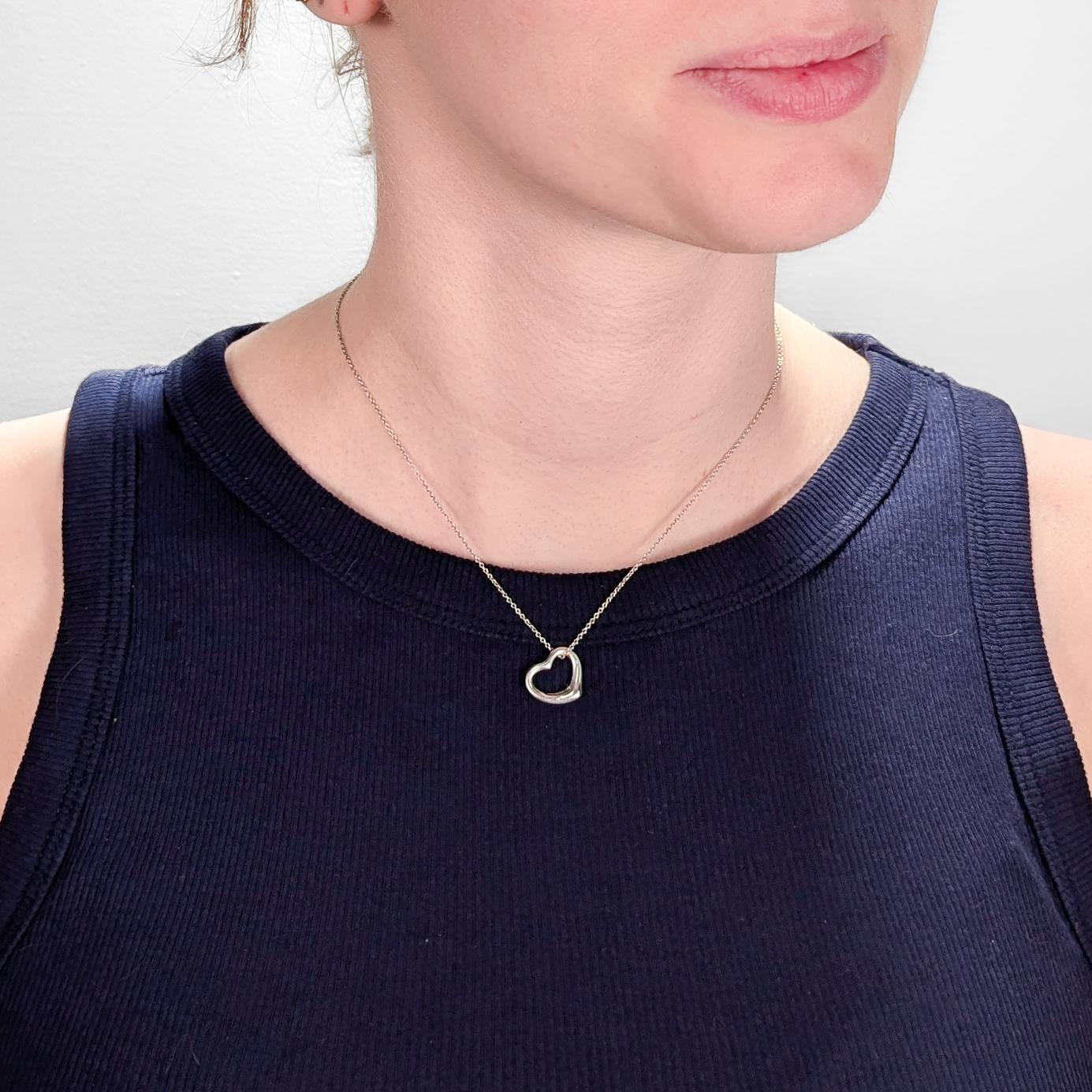 A fine designer silver necklace.

In sterling silver.

Designed by Elsa Peretti for Tiffany & Co.

From the Open Heart series.

Together with a Tiffany sterling silver chain.

Marked Tiffany & Co. / © / Elsa Peretti / 925 / Spain to the