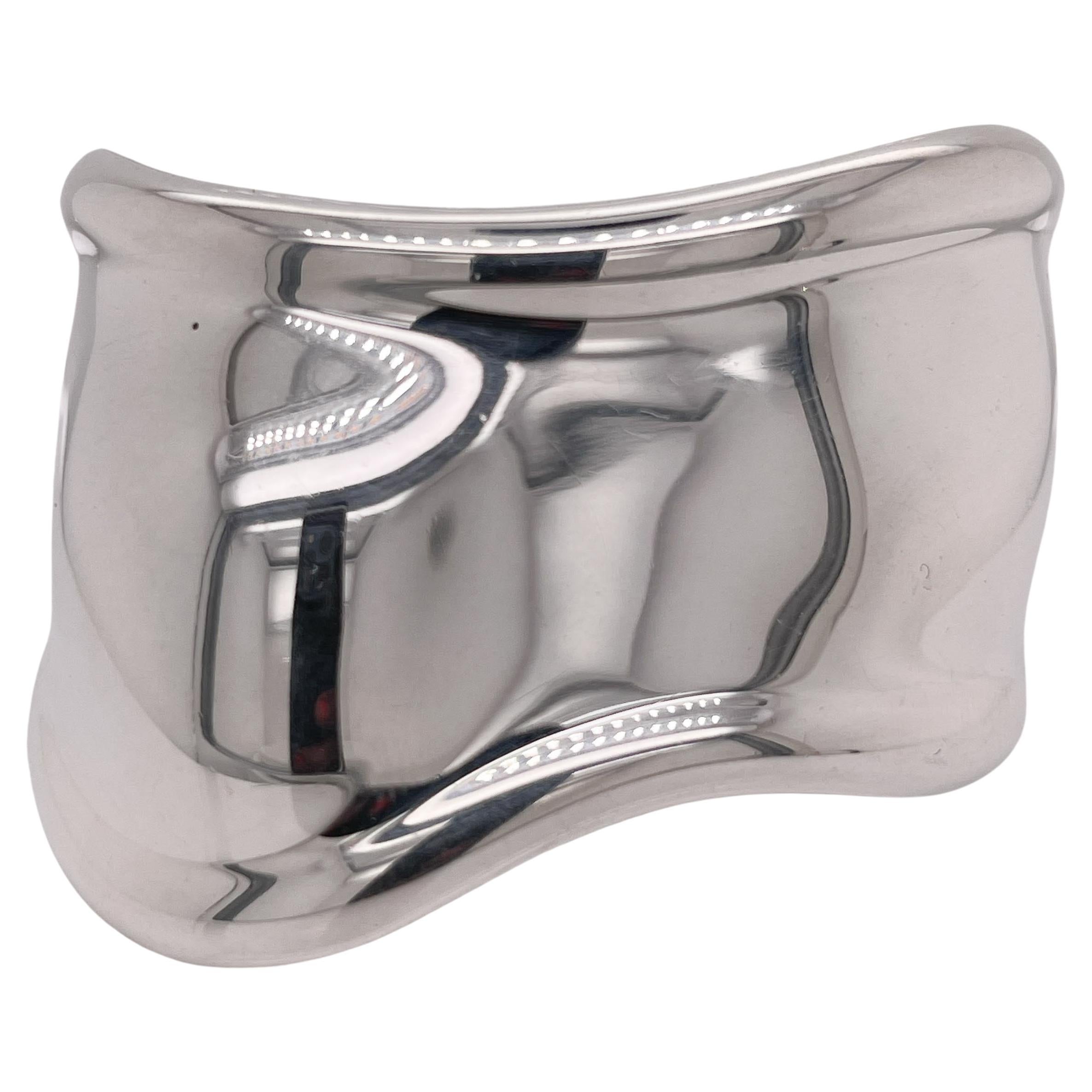A fine, vintage Tiffany & Co. Bone cuff bracelet.

In sterling silver for the right hand.

Designed by Elsa Peretti. 

Simply an iconic bracelet!

Date:
Late 20th Century

Overall Condition:
It is in overall good, as-pictured, used estate condition