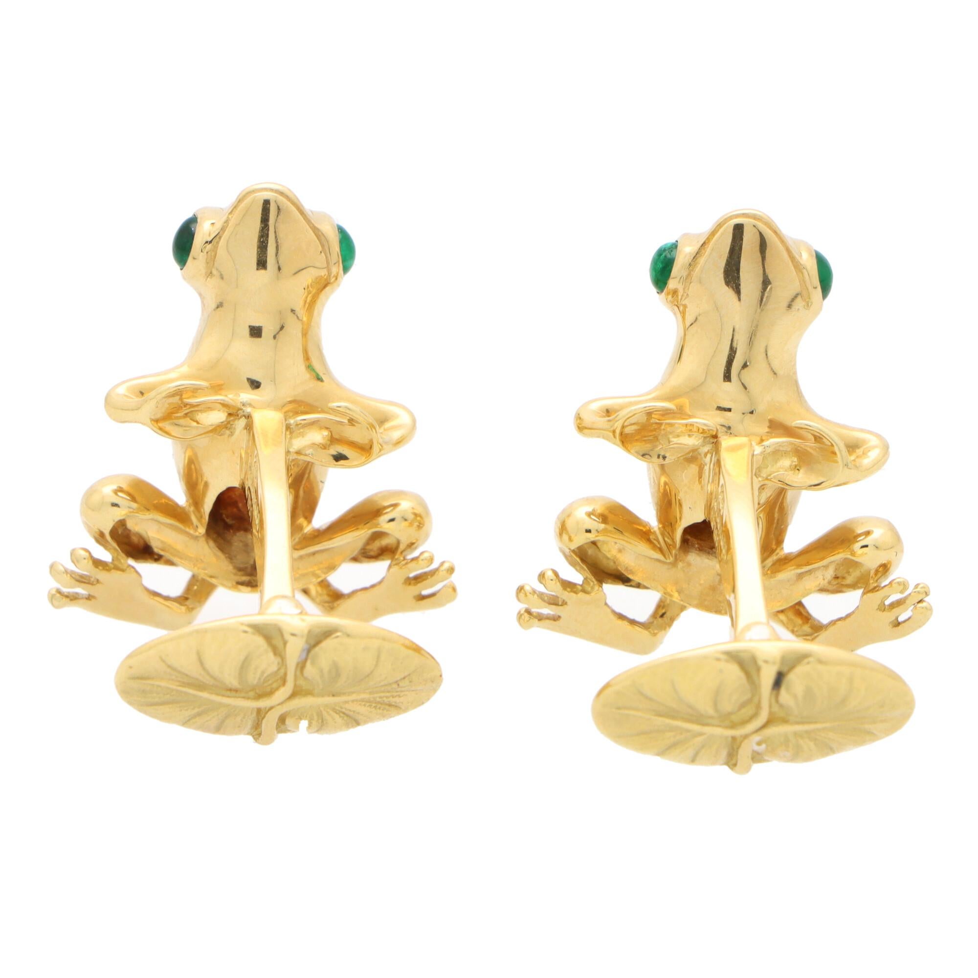 A rather beautiful pair of vintage Tiffany & Co. emerald frog cufflinks set in 18k yellow gold.

Each cufflink depicts a sitting frog, expertly crafted and detailed in solid yellow gold. The frog backs have been detailed with a textured effect and