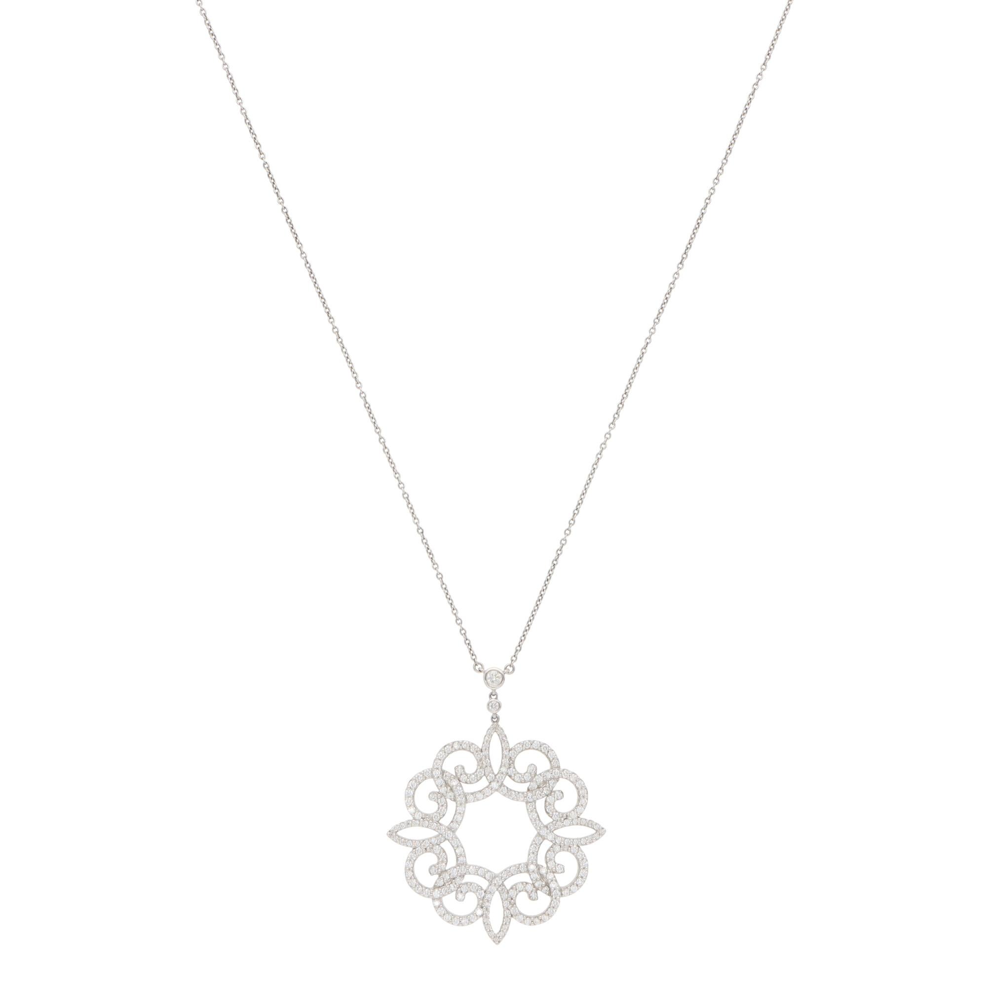 A beautiful vintage Tiffany & Co. Enchant Scroll diamond pendant necklace set in platinum.

From the iconic Enchant collection, the pendant depicts a floral motif set with 210 round brilliant-cut diamonds. The top diamonds are encased in platinum