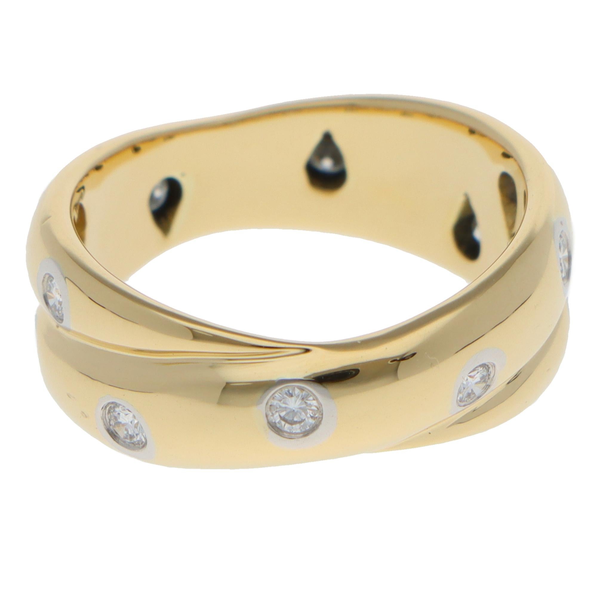 A beautiful vintage Tiffany & Co. Etoile diamond twist dots ring set in 18k yellow gold and platinum.

From the discontinued Etoile collection, the ring is composed of 12 round brilliant cut diamonds in a  twisting polished yellow band. Each diamond