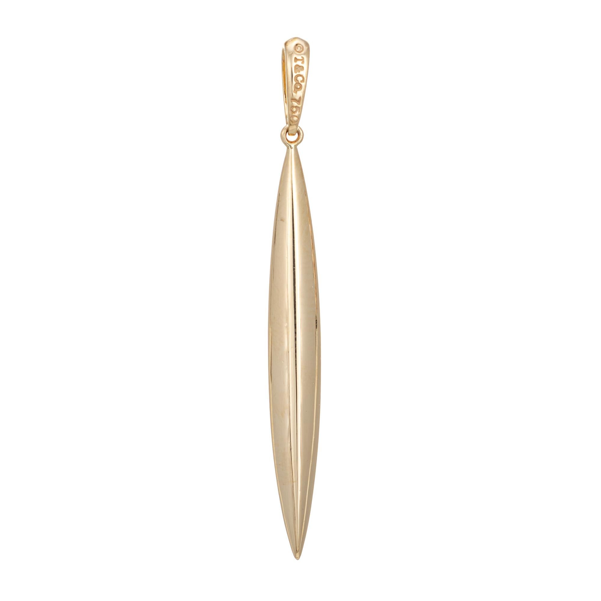Finely detailed vintage Tiffany & Co feather pendant crafted in 18 karat yellow gold.  

The pendant is a hard-to-find retired piece and no longer made by Tiffany & Co. Modeled in the form of a feather (can also been seen as a spike) the piece is