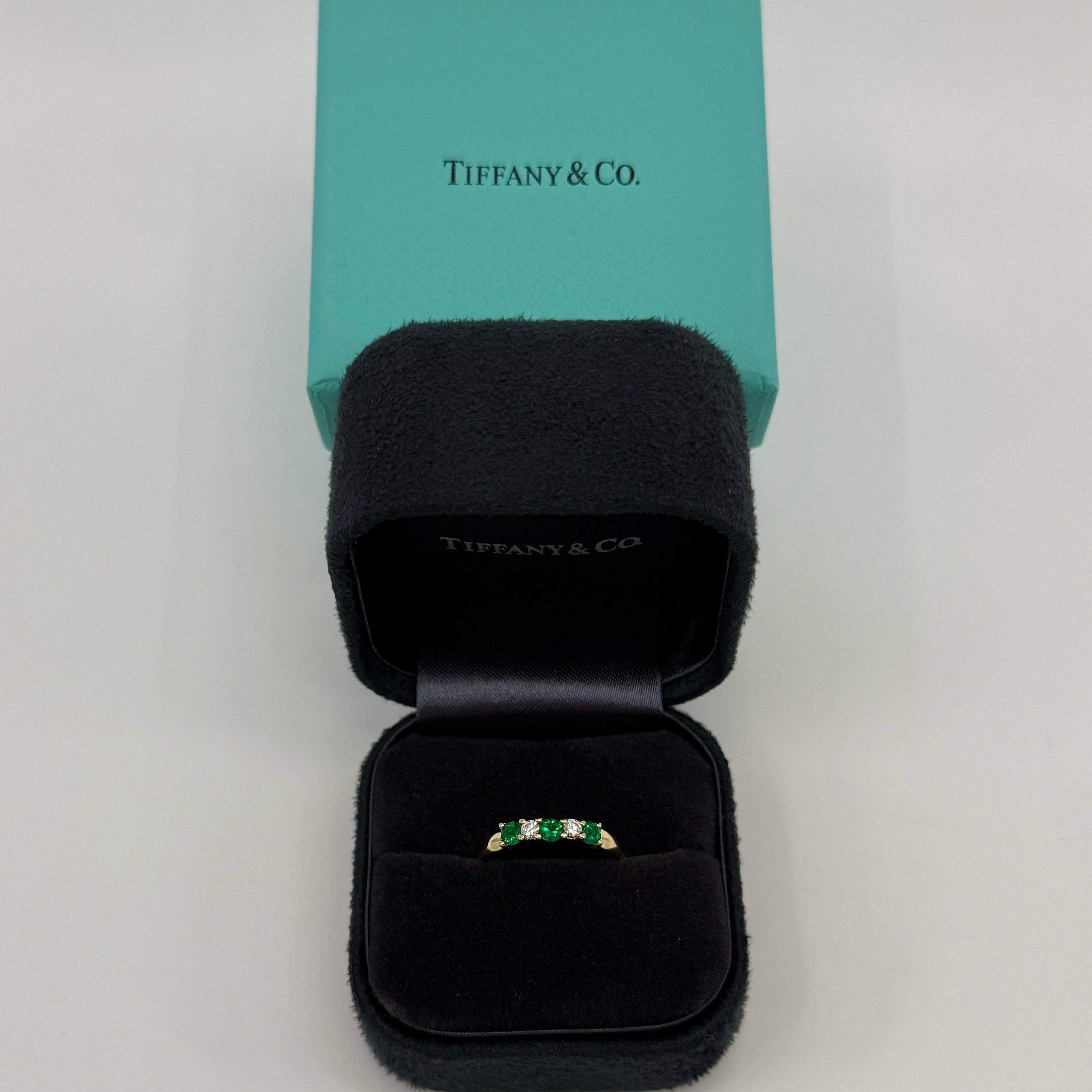 Vintage Tiffany & Co Fine Vivid Green Emerald & Diamond 18k Yellow Gold Five Stone Ring.

Stunning yellow gold ring set with x3 fine vivid green emeralds measuring 3mm and x2 round brilliant cut natural diamonds measuring 2.4mm.

Fine jewellery