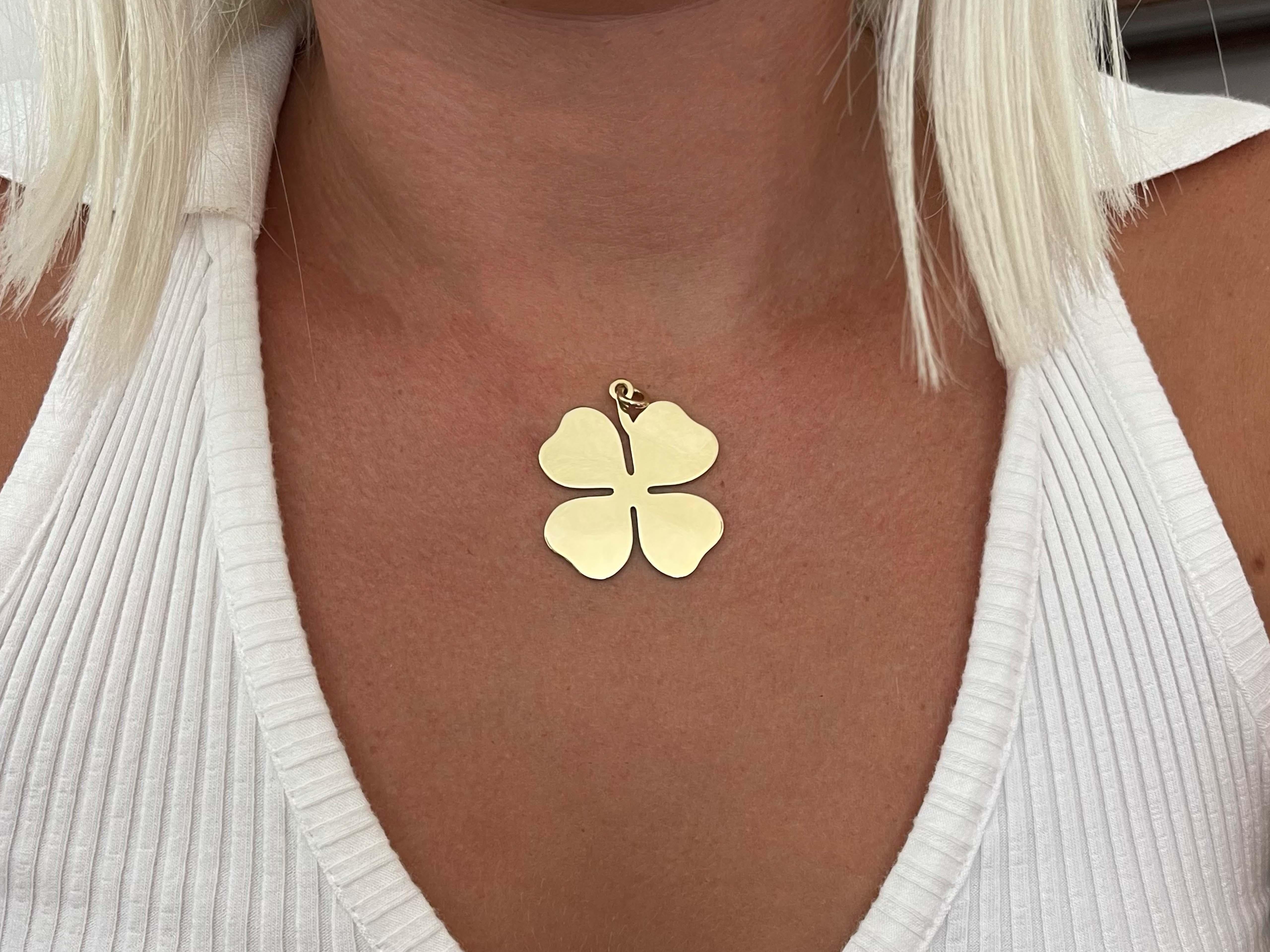 Rare Tiffany and Co. large four-leaf clover charm pendant. Made and signed by Tiffany & Co. in 14K yellow gold. Measures 37mm x 37 mm. diameter. The pendant is hallmarked 