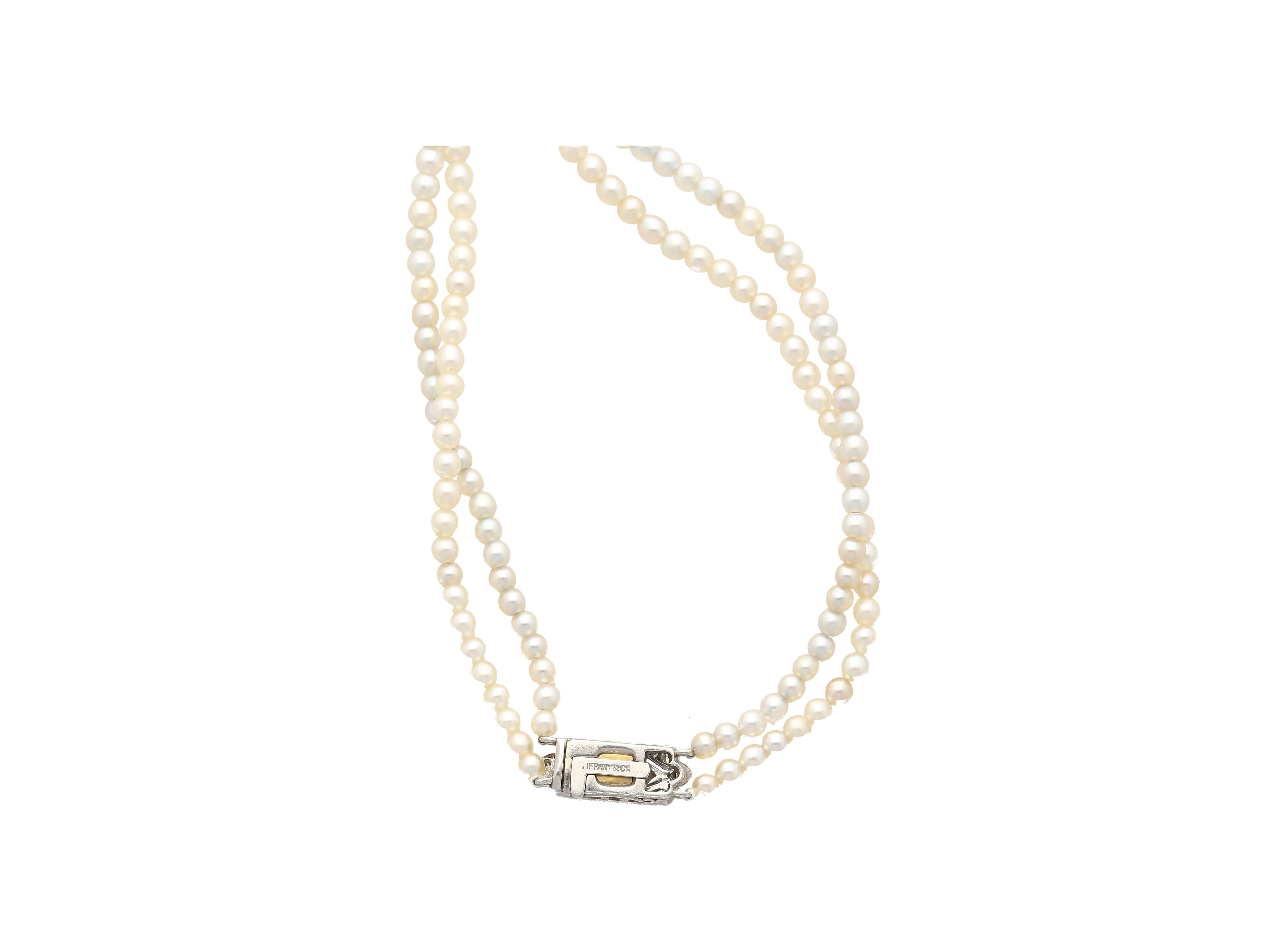 Tiffany & Co. signed vintage natural saltwater pearl double-stranded necklace with diamond box and safety closure. This necklace is a relic of history and an archetype of the pristine Tiffany & Co. craftsmanship and quality materials. Featuring 224