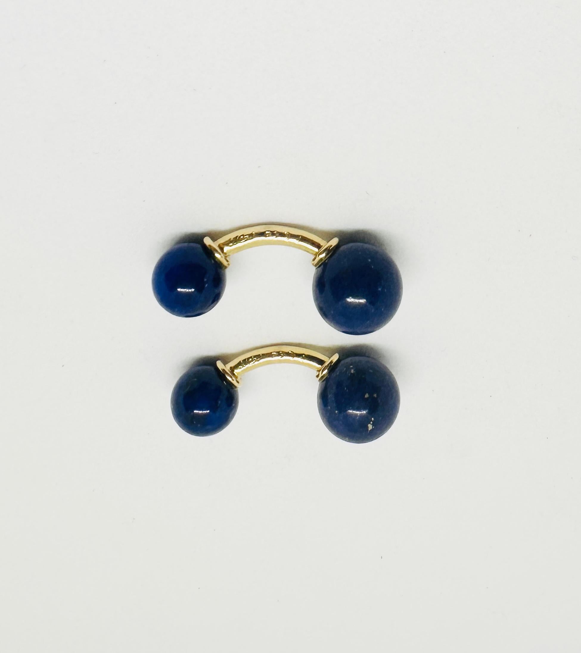 Classic, double-sided cufflinks featuring lapis lazuli spheres with solid yellow gold connectors by Tiffany & Co.

There's a reason why lapis remains one of the most popular gemstones; the rich blue color with gold-colored flecks of pyrite enable it