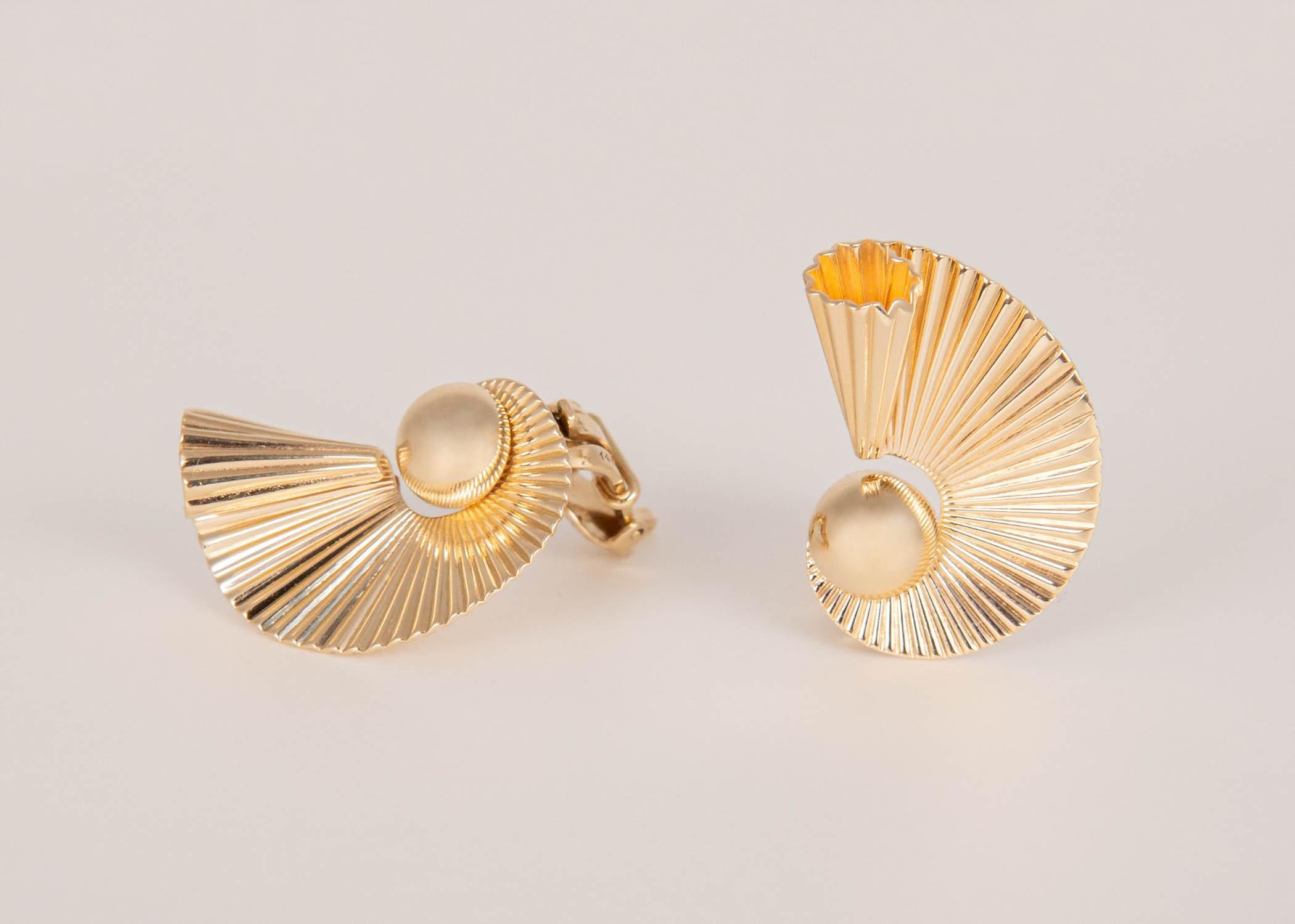 This pair of Mid-century earrings is elegant and a wonderful flattering shape. 7/8's of an inch in length