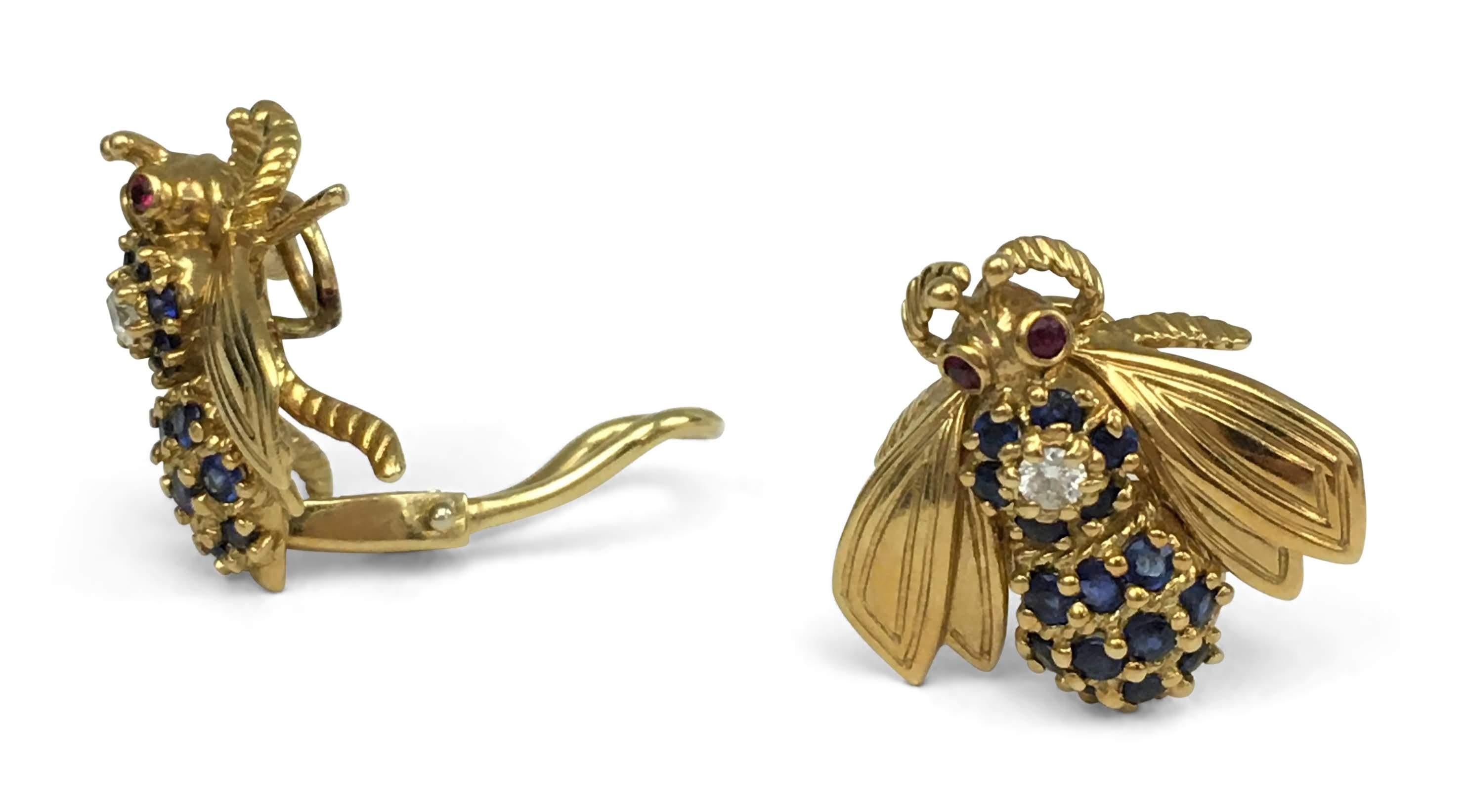Vintage Tiffany & Co. bumblebee earrings crafted in 18 karat yellow gold featuring well matched round cut blue sapphires (approx 1.30 cttw) with a round brilliant cut diamond weighing an estimated 0.10 carats total in the center. The bumblebees are