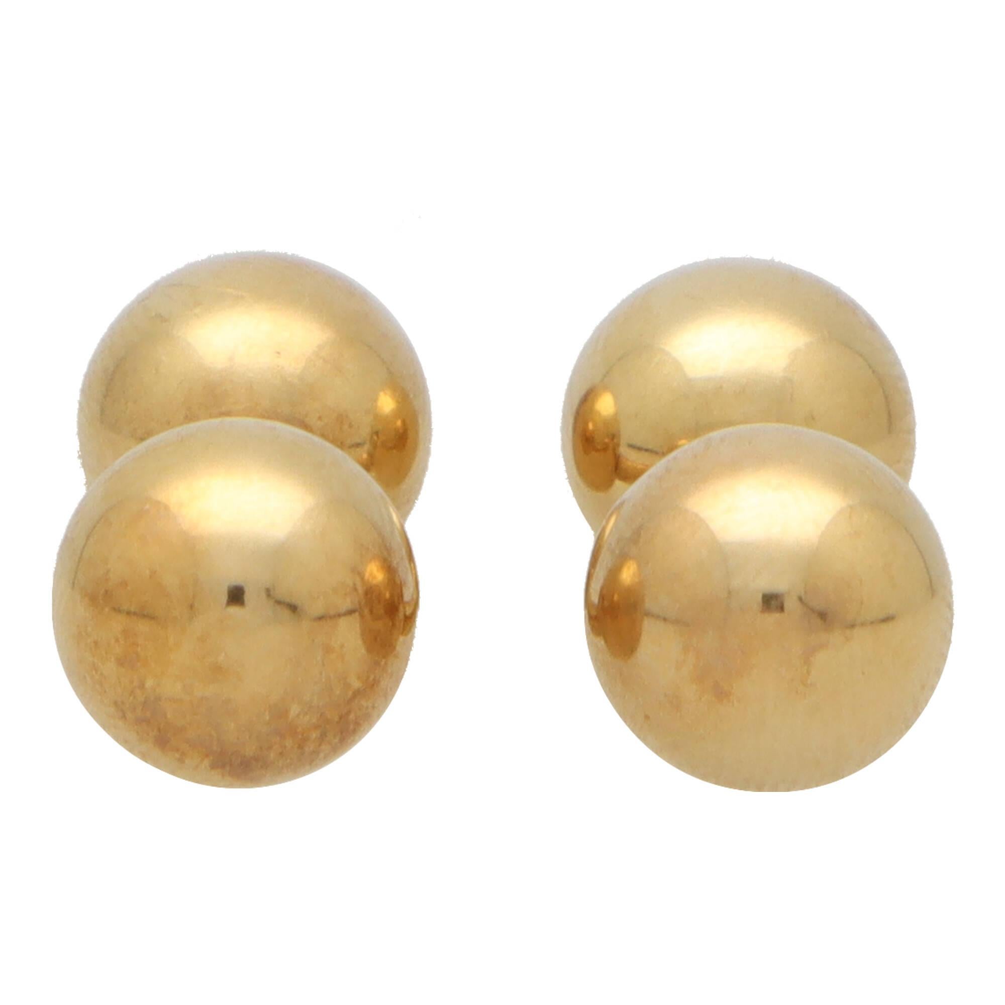 A extremely stylish pair of vintage Tiffany & Co. ball cufflinks in 18k yellow gold.

Each cufflink is composed of a yellow gold bar, sided with a polished yellow gold ball.

Due to the design these cufflinks can easily be paired with a variety of