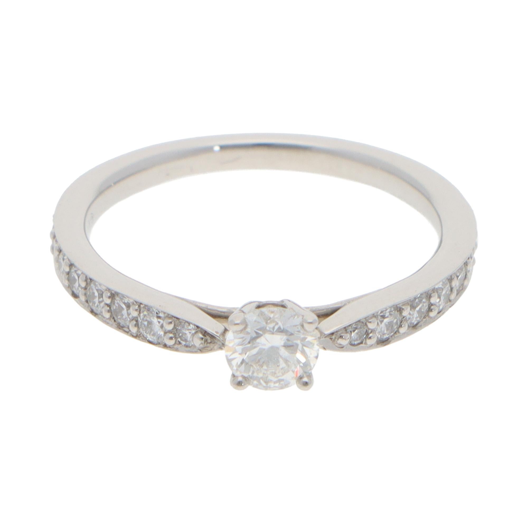 A beautiful vintage Tiffany & Co. Harmony diamond engagement ring set in platinum.

From the current Tiffany & Co. Harmony wedding collection, the ring is composed of a round brilliant-cut diamond centrally four-claw and 18 smaller diamonds