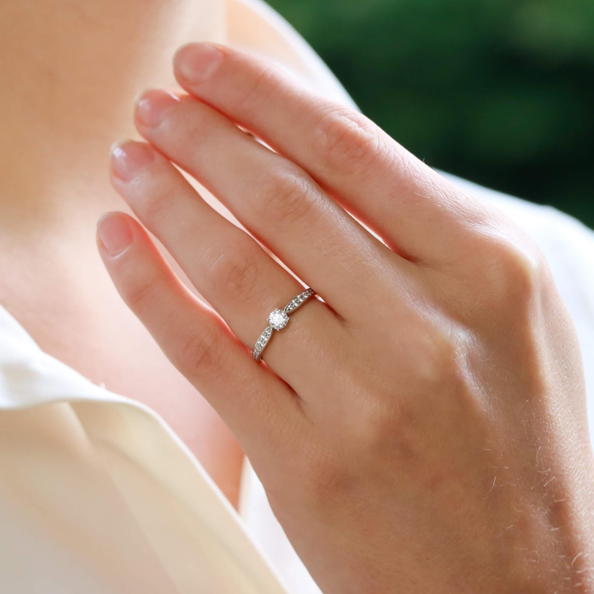 A beautiful vintage Tiffany & Co. ‘Harmony’ round brilliant cut diamond ring set in platinum.

From the discontinued Tiffany Harmony collection, the piece prominently features a beautiful certified 0.24 carat cushion cut diamond. The diamond is four