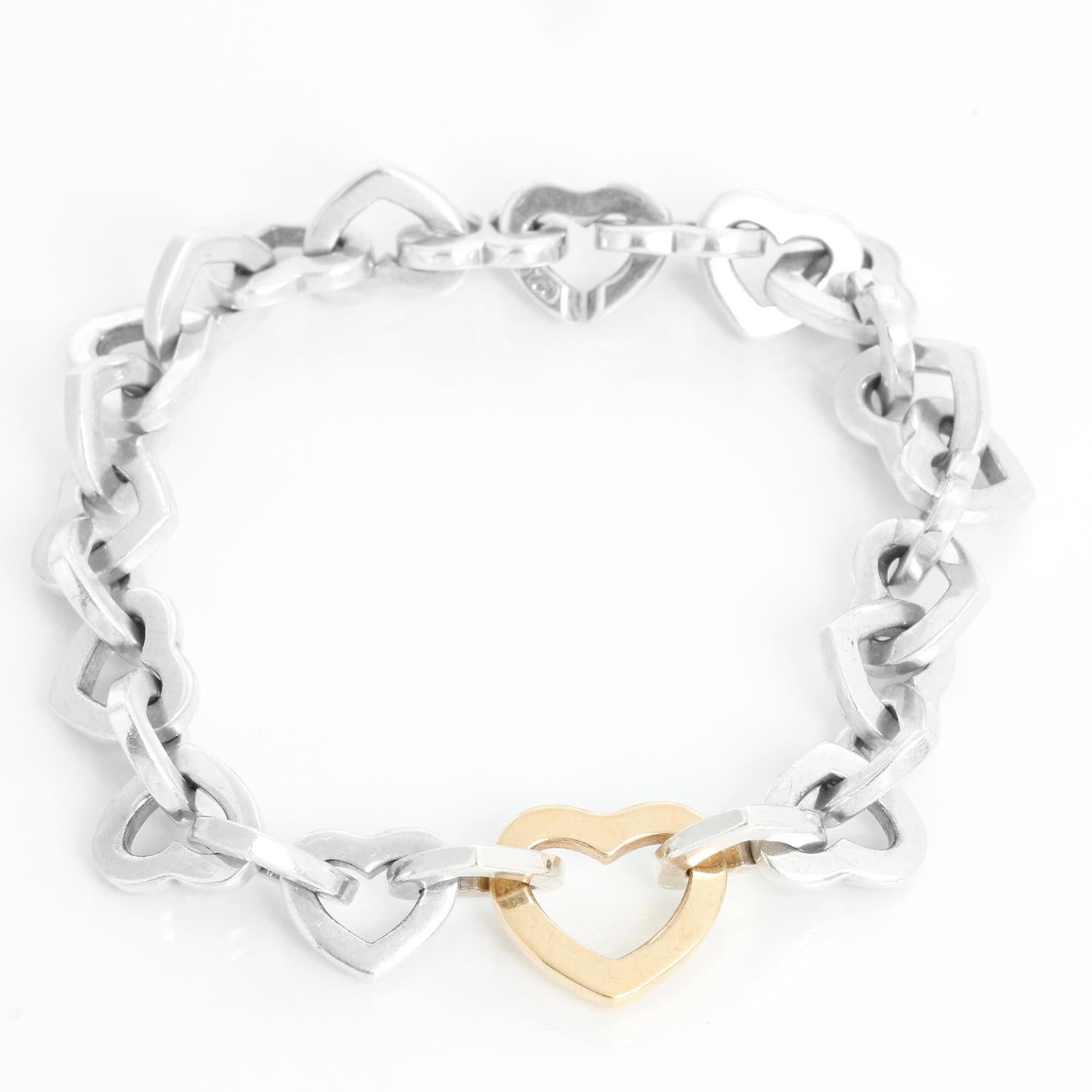 Vintage Tiffany & Co. Heart Link Bracelet  - Tiffany & Co Interlocking Hearts vintage bracelet. Sterling silver with 18k gold pendant (center heart). Measures 7 1/2  inches. Hallmarked, Pre-owned with Tiffany pouch and box.