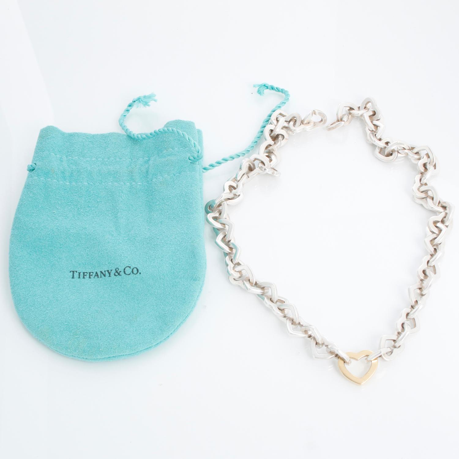Vintage Tiffany & Co. Heart Link Necklace  - Tiffany & Co Interlocking Hearts vintage necklace. Sterling silver with 18k gold pendant (center heart). Measures 16 inches. Hallmarked, Pre-owned with Tiffany pouch and box 

