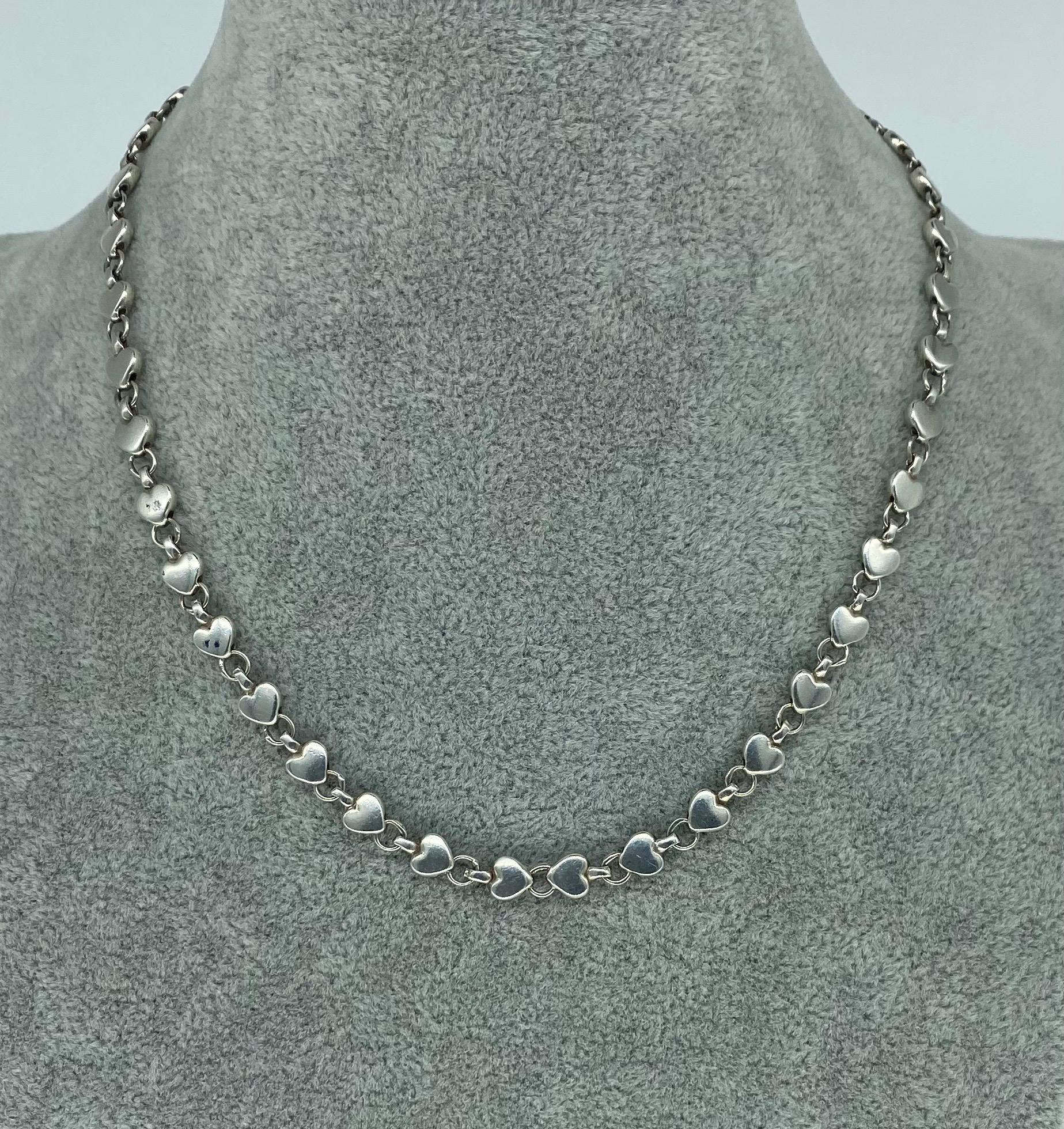 Vintage Tiffany & Co Heart Link Necklace Sterling Silver 925. Beautiful ongoing links of Hearts all over this necklace made by Tiffany & Co.
This necklace is 100% authentic Tiffany & co necklace. No original box/papers. The necklace measures 16