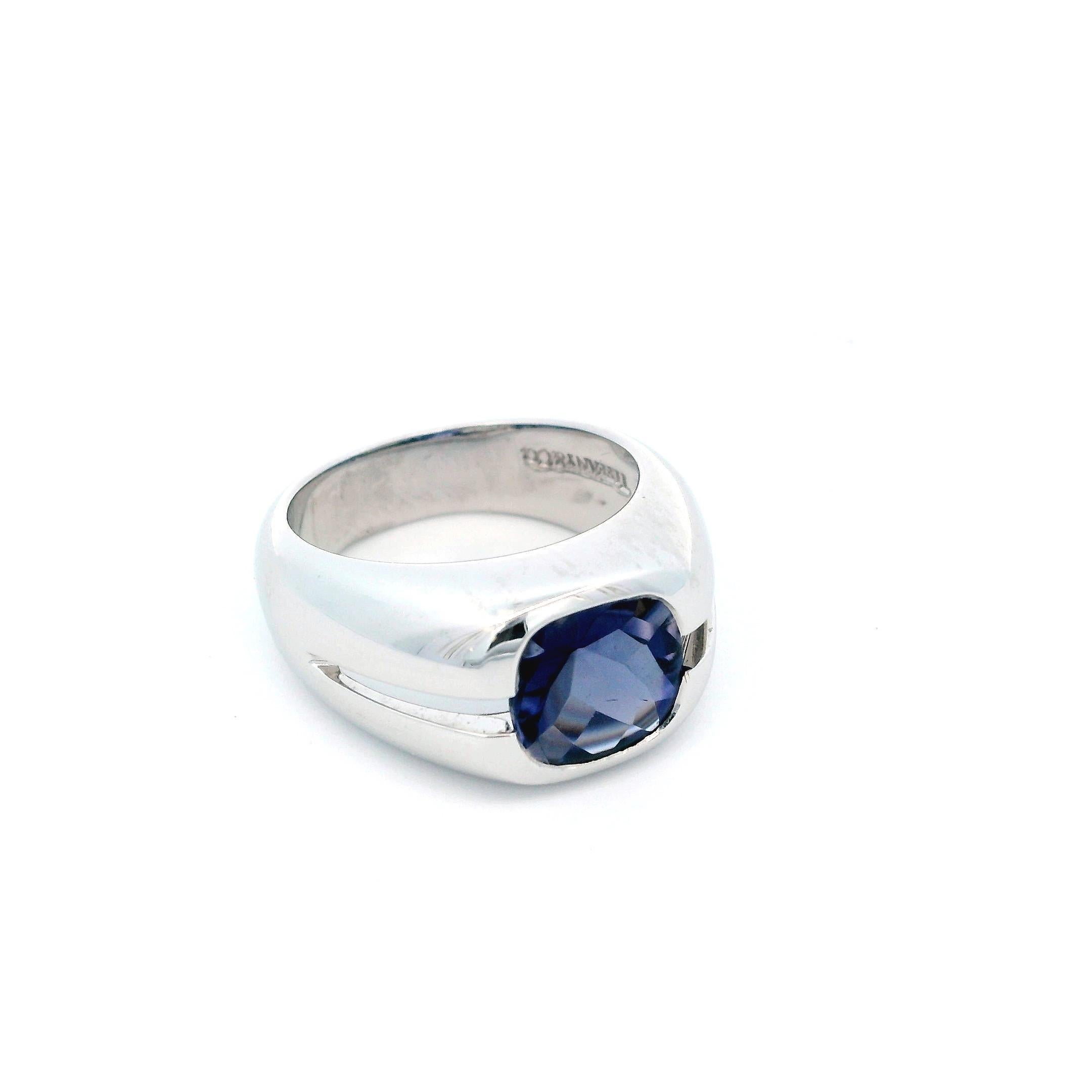 A striking Iolite Ring by Tiffany & Co., featuring a captivating 3.0ct Purple Cabochon Iolite set in 18k White Gold.

Ring size 5.5