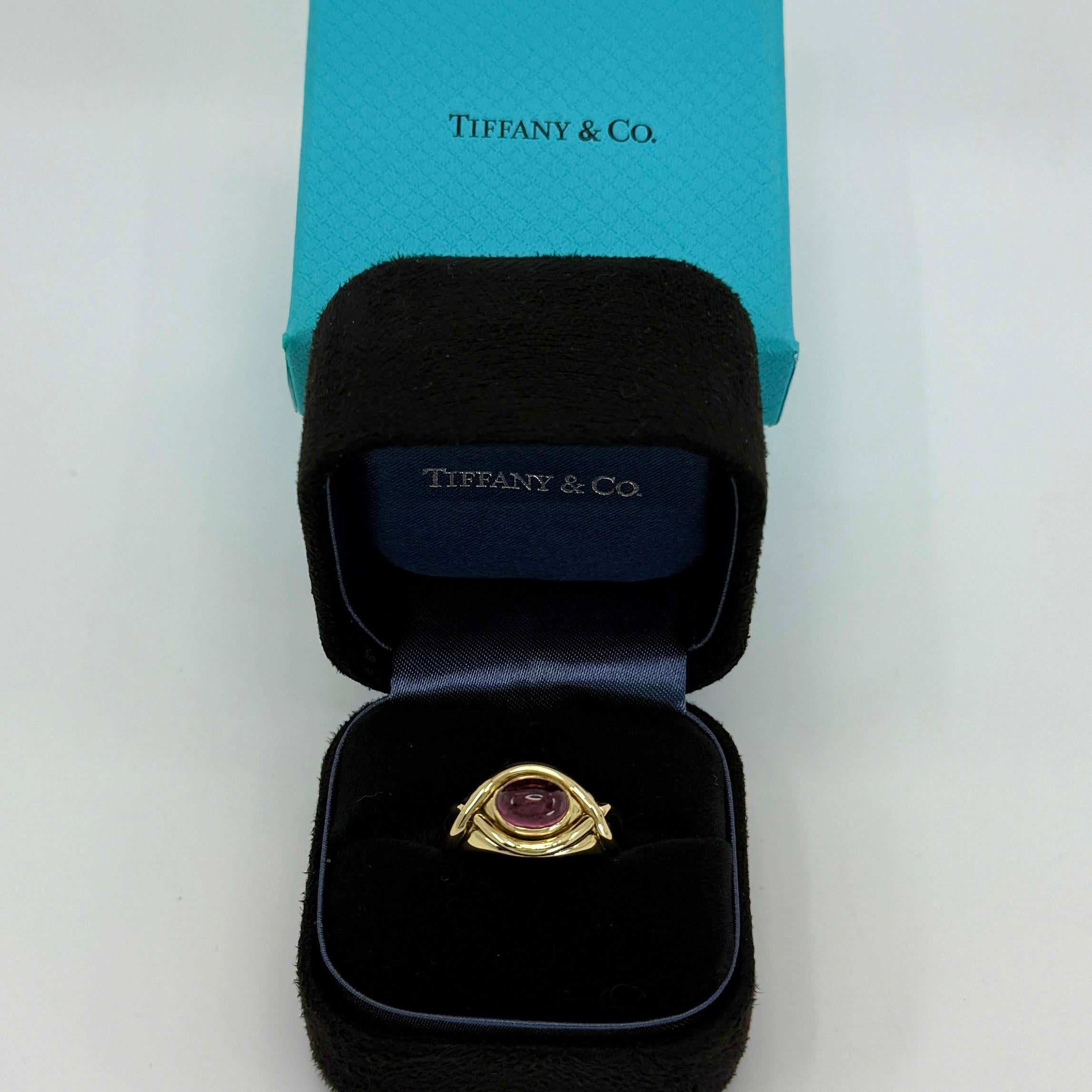 Rare Tiffany & Co. Light Pink Tourmaline Oval Cabochon Cut 18k Yellow Gold Band Dome Ring.

A stunning yellow gold ring set with a stunning light pink oval cabochon cut natural tourmaline. Beautiful bright pink colour with some small natural