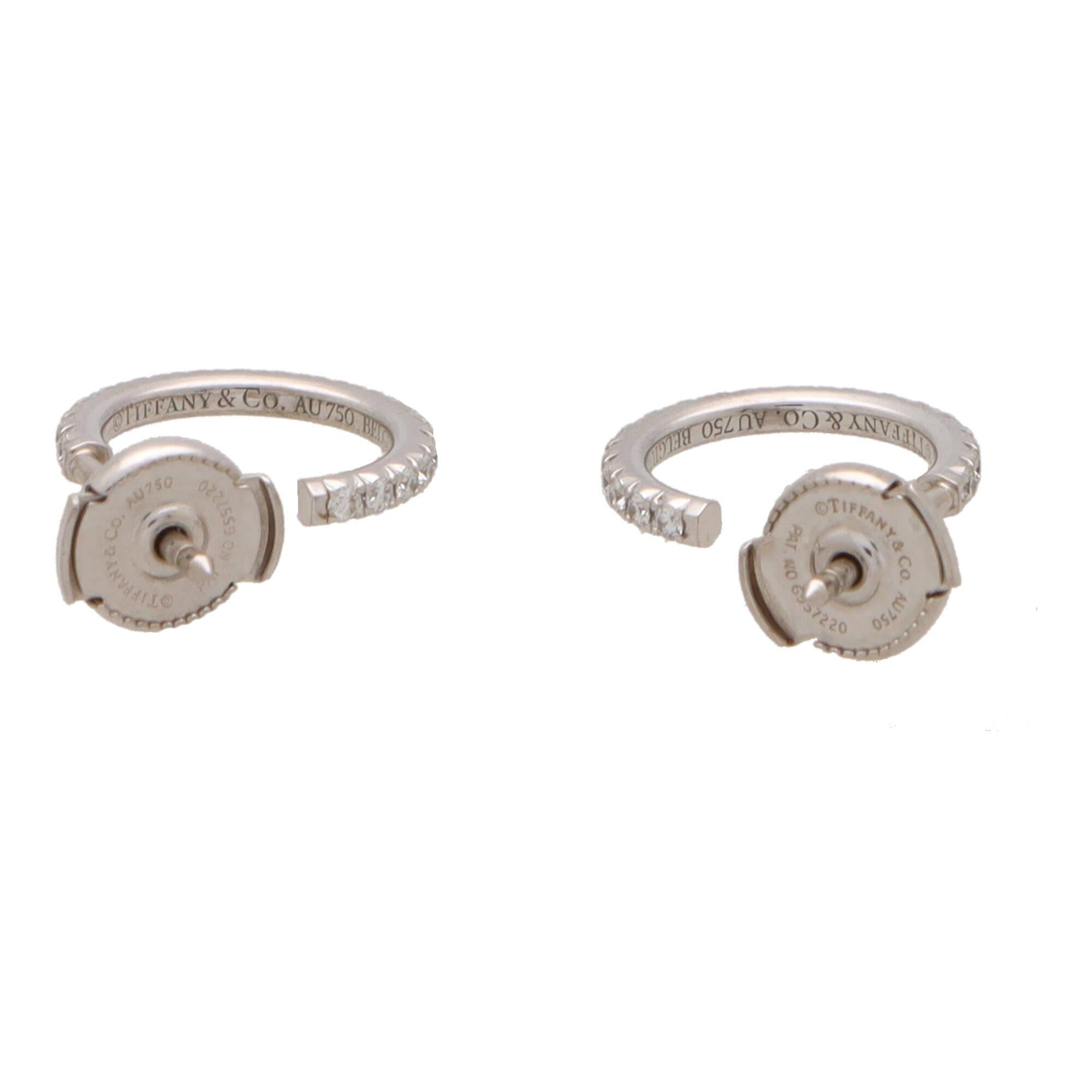 A stylish pair of vintage Tiffany & Co. ‘Tiffany Metro’ diamond hoop earrings set in 18k white gold.

From the current Tiffany Metro collection, each earring is composed of an elegant claw set hoop, set throughout with 19 round brilliant cut