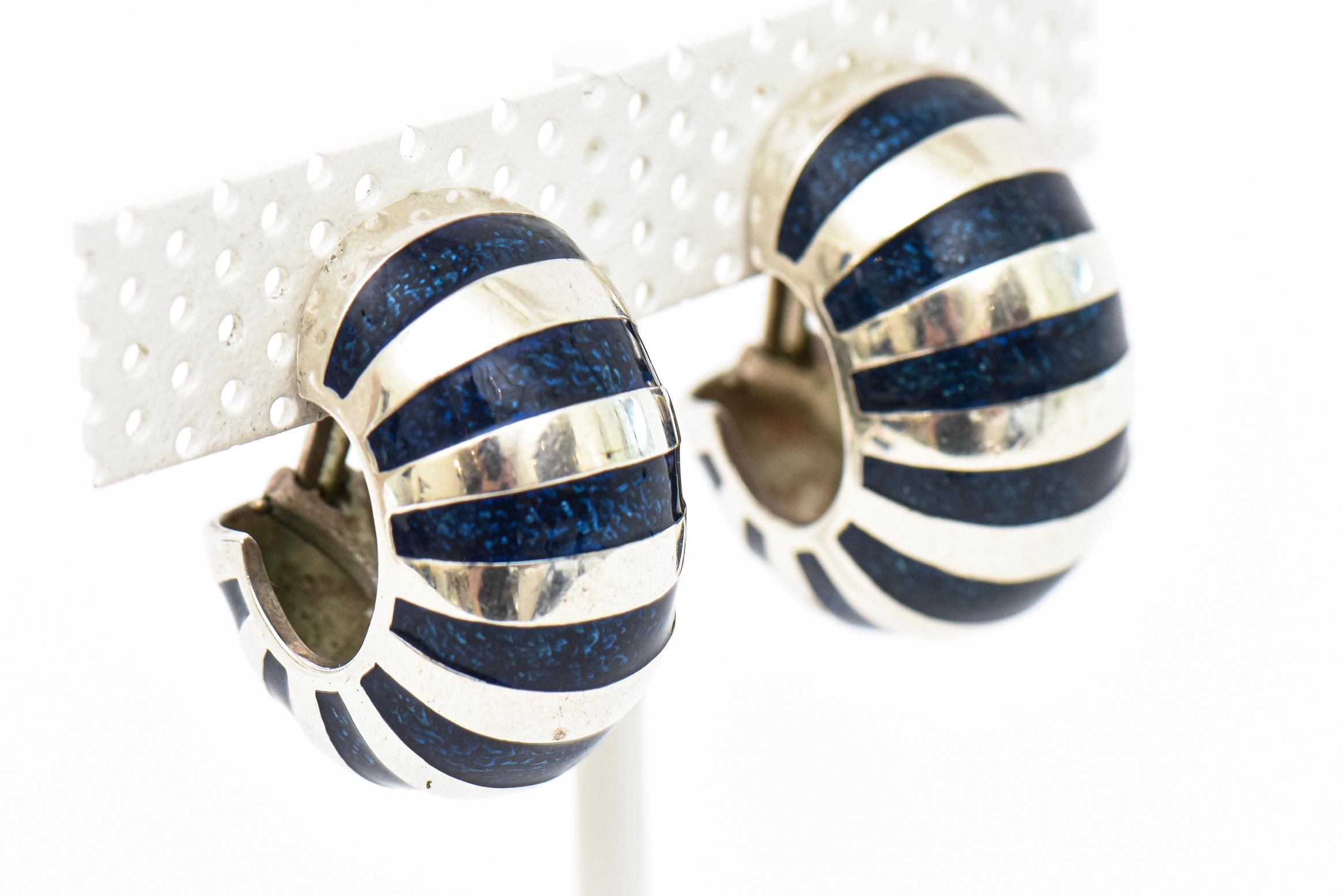 This lovely vintage hallmarked Tiffany &Co hoop lever back earrings are coined the shrimp tail. These are the large size and are a rich dark navy blue enamel with sterling silver. The navy blue is more desirable and collectable and harder to come by