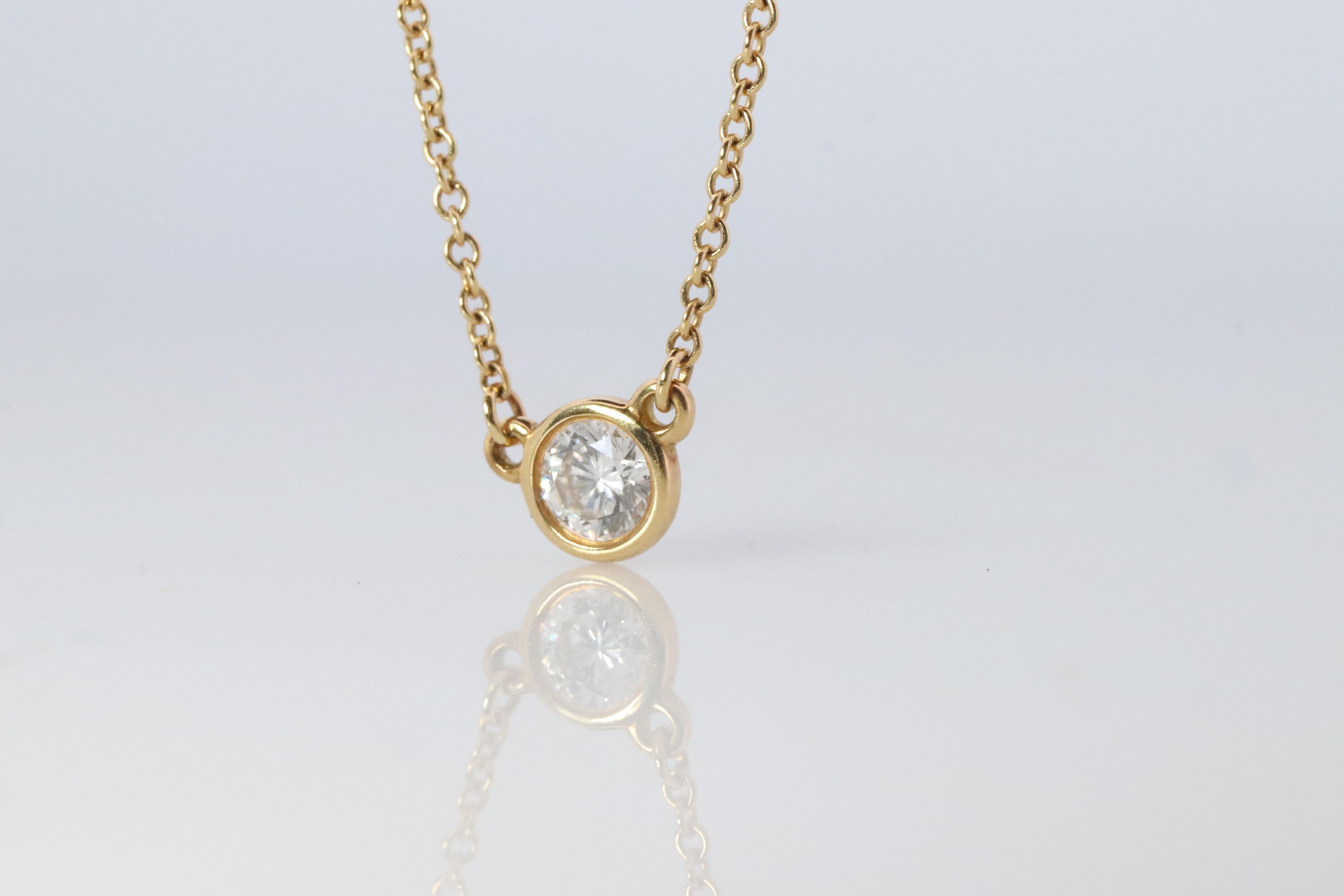 Tiffany and Co. 18k Yellow Gold and diamond necklace

Elsa Peretti Single diamond 