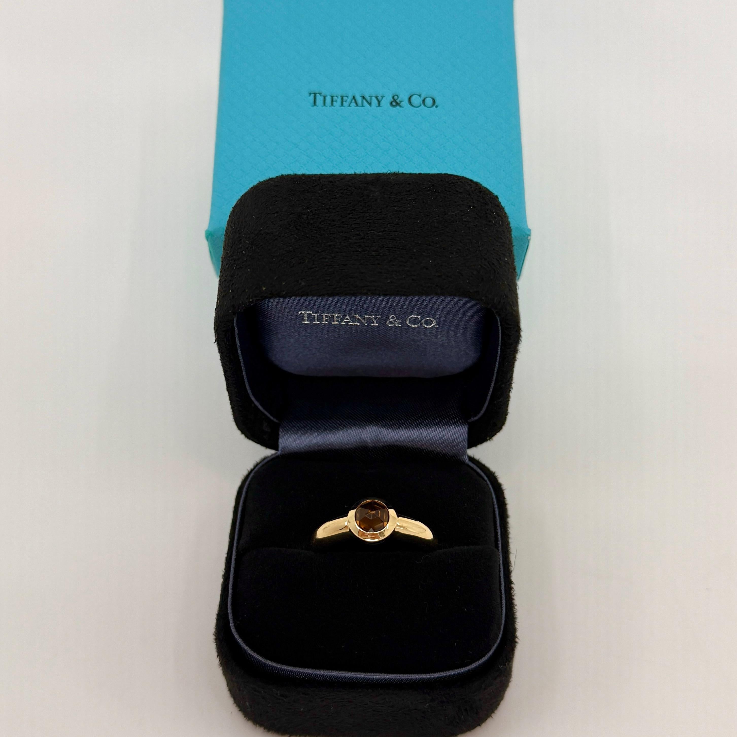Rare Tiffany & Co. Vivid Orange Yellow Citrine Rose Cut 18k Yellow Gold Bezel Solitaire Ring.

A beautifully made yellow gold ring set with a stunning vivid orange natural citrine. Superb colour, clarity and unique rose cut. Fine jewellery houses