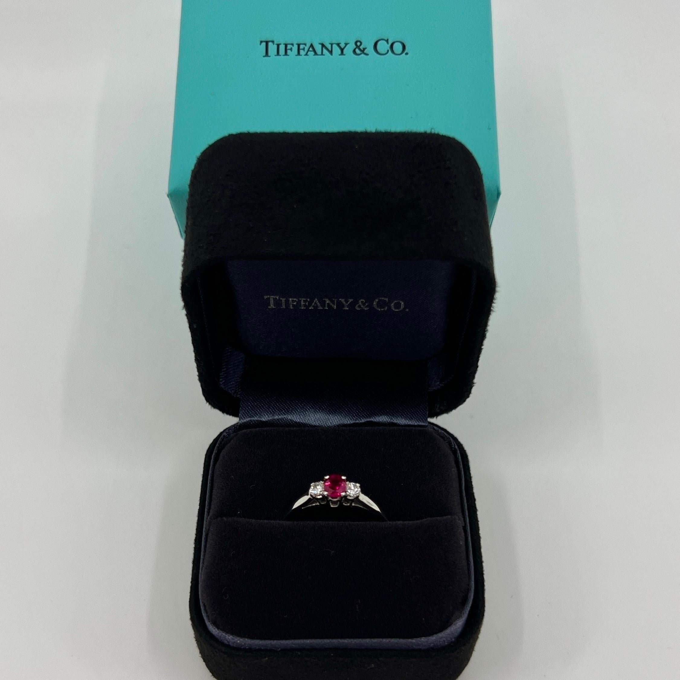 Vintage Tiffany & Co Oval Cut Pink Red Ruby And Diamond Platinum Three Stone Ring.

Fine jewellery houses like Tiffany only use the finest diamonds and gemstones in their jewellery and this piece is no exception. A top quality 4.5x3.7mm oval cut