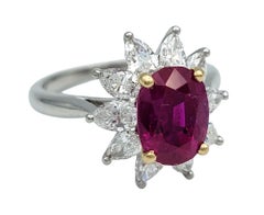 Vintage Tiffany & Co. Oval Cut Ruby and Pear Diamond Halo Ring in Platinum